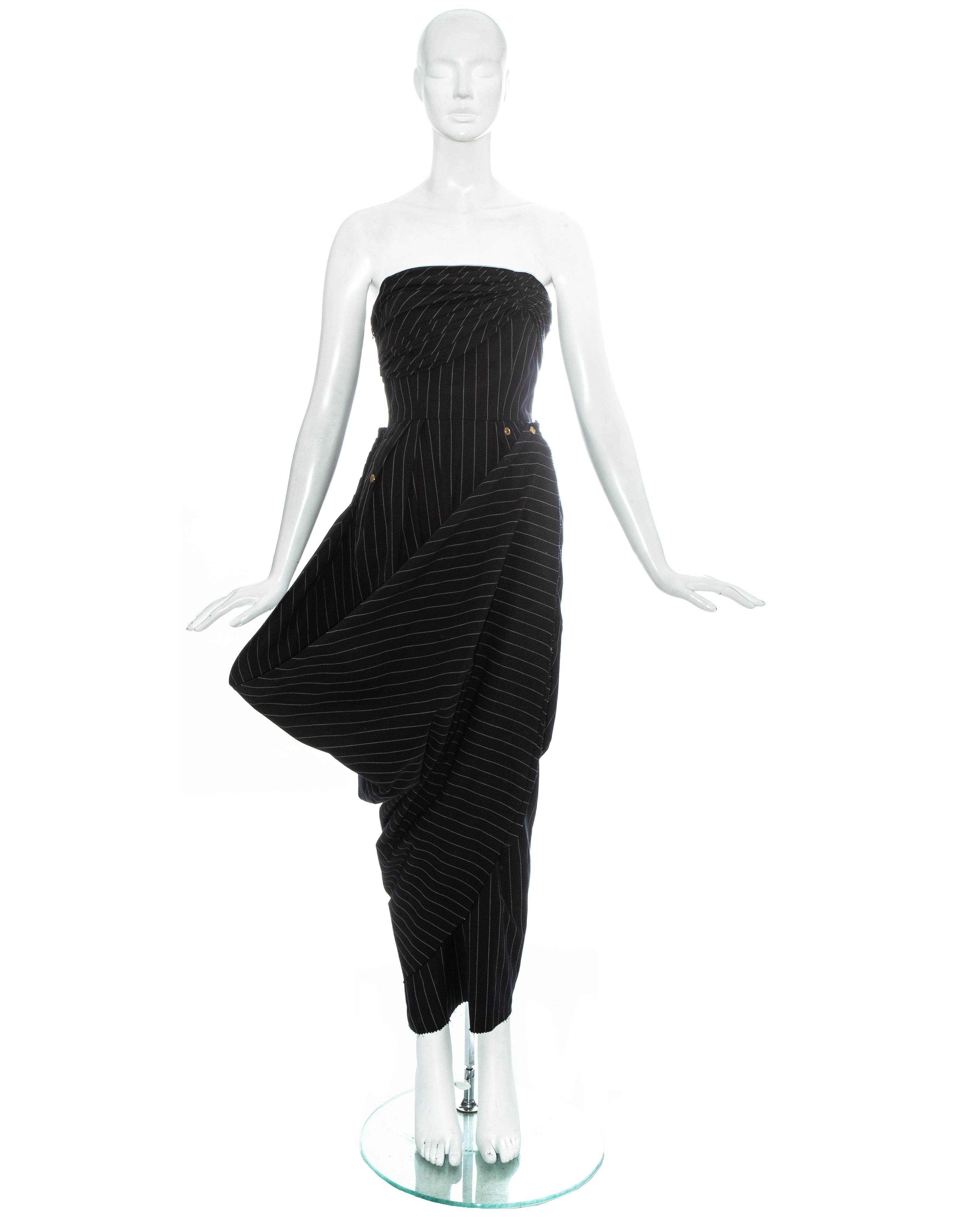 Jean Paul Gaultier black pinstripe wool strapless evening dress. Internal corset with boning and waist-stay, side zip fastening, pleating around bust and hips, long skirt drapes around the hips and fastens with a press stud, multiple press stud