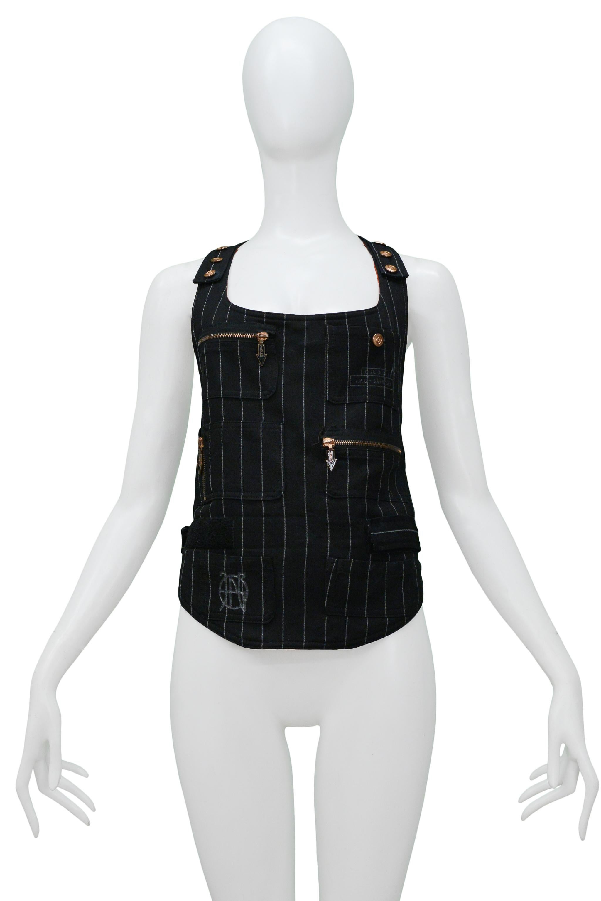 Resurrection Vintage is excited to offer a vintage Jean Paul Gaultier black and white pinstripe vest featuring zipper patch pockets, snaps along the shoulders, and a velcro strap around the waist.

Jean Paul Gaultier
Size: XL
Woven
Excellent Vintage