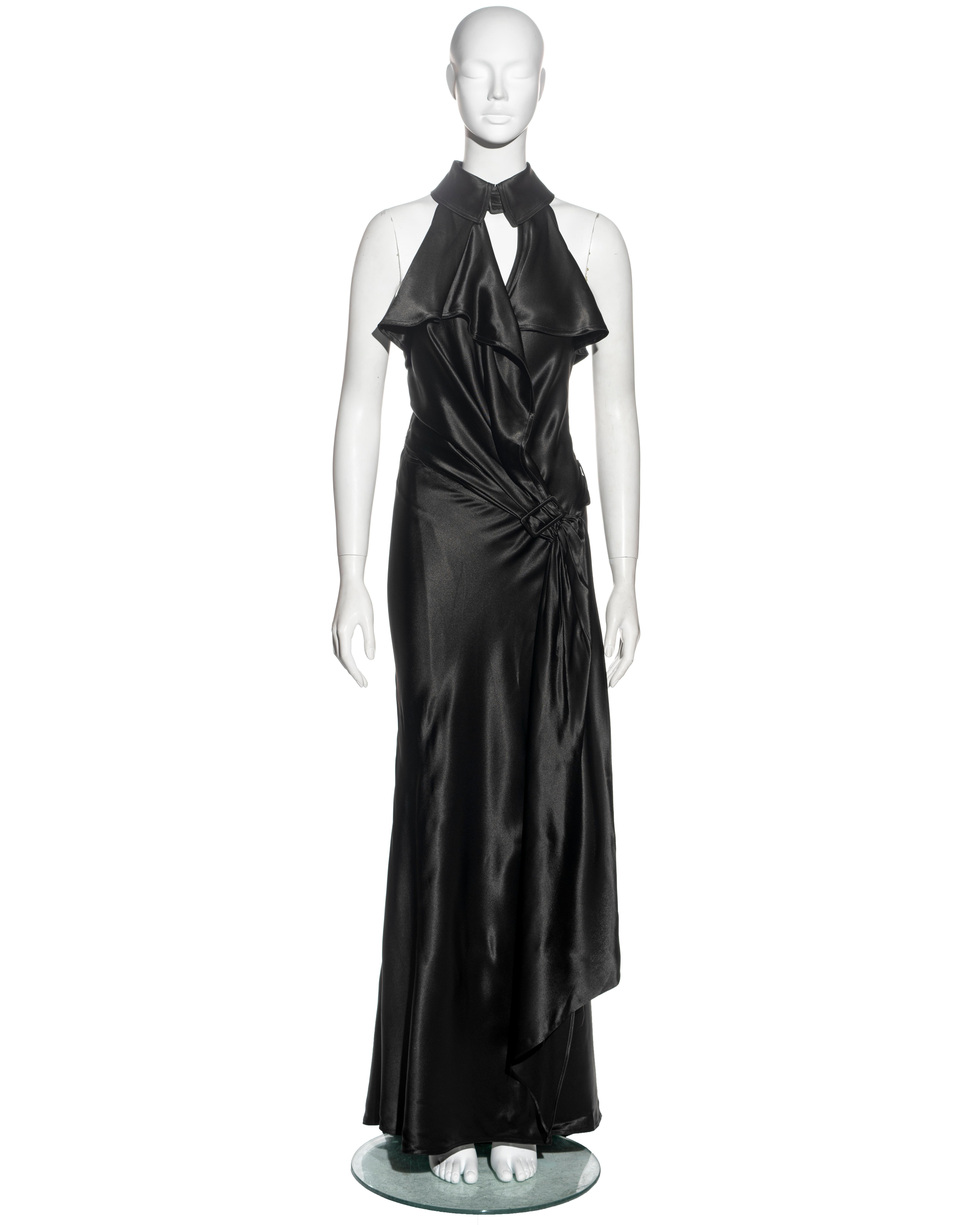 ▪ Jean Paul Gaultier evening wrap dress
▪ Sold by One of a Kind Archive
▪ Constructed from black rayon-blend satin 
▪ Trench-style 
▪ Asymmetric draped bodice 
▪ Open back 
▪ Wrap fastening with built-in belt 
▪ IT 40 - FR 36 - UK 8
▪ Fall-Winter