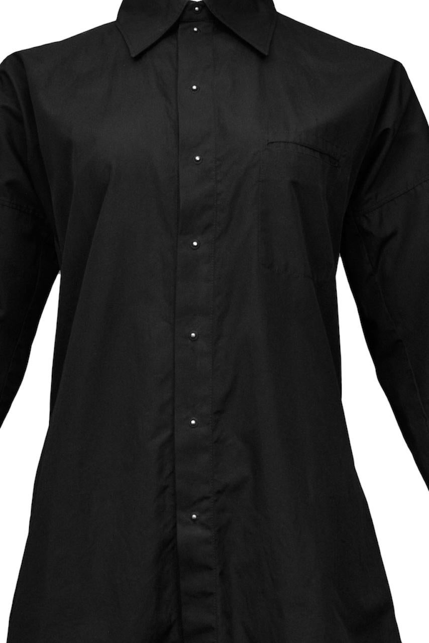 Resurrection Vintage is excited to offer a vintage Jean Paul Gaultier black cotton shirt featuring long sleeves, folding collar, back loop, and silver ball hardware for buttons.

Jean Paul Gaultier
Size F38 or I42
Cotton
Excellent Vintage