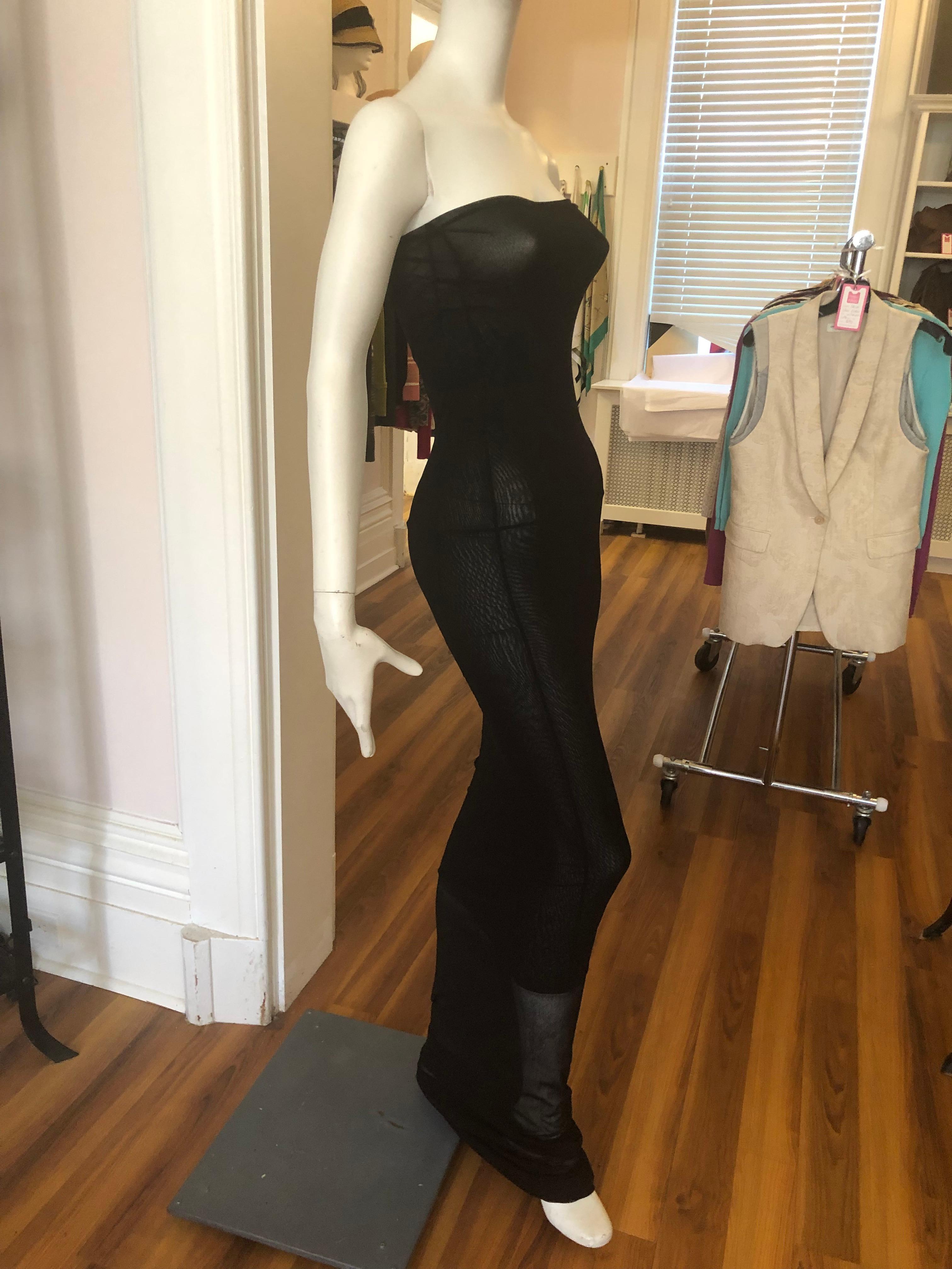 This Jean Paul Gaultier Maille Femme maxi tube dress is from the late 1990s, and in excellent condition.
Made of nylon mesh it molds the body but is stretchy. It is marked M, but definitely fits a small as well.
The material has a squiggly print,