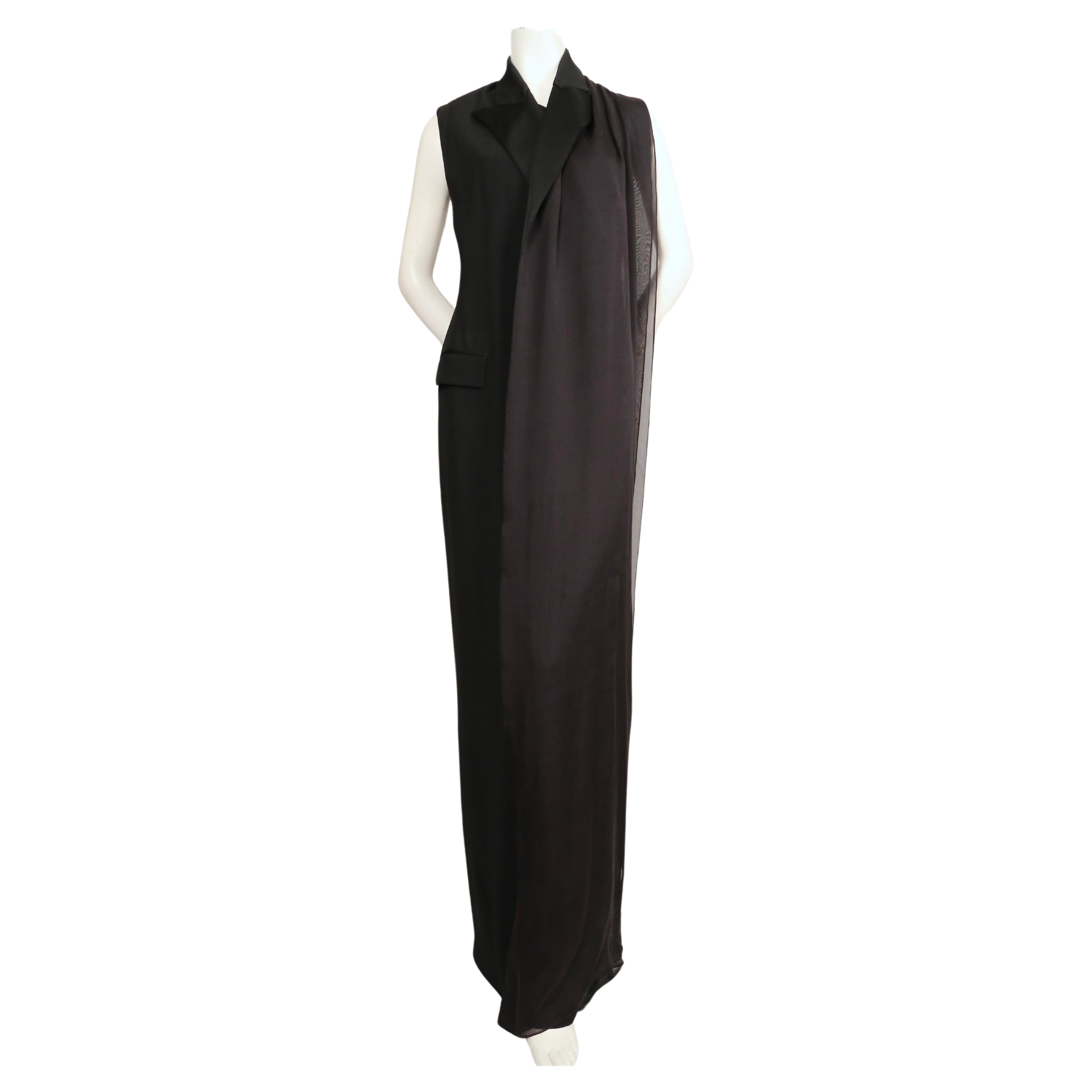 Black tuxedo gown with satin trim and draped silk scarf designed by Jean Paul Gaultier. Labeled a French size 38 (Italian 42). Approximate measurements: 33-34