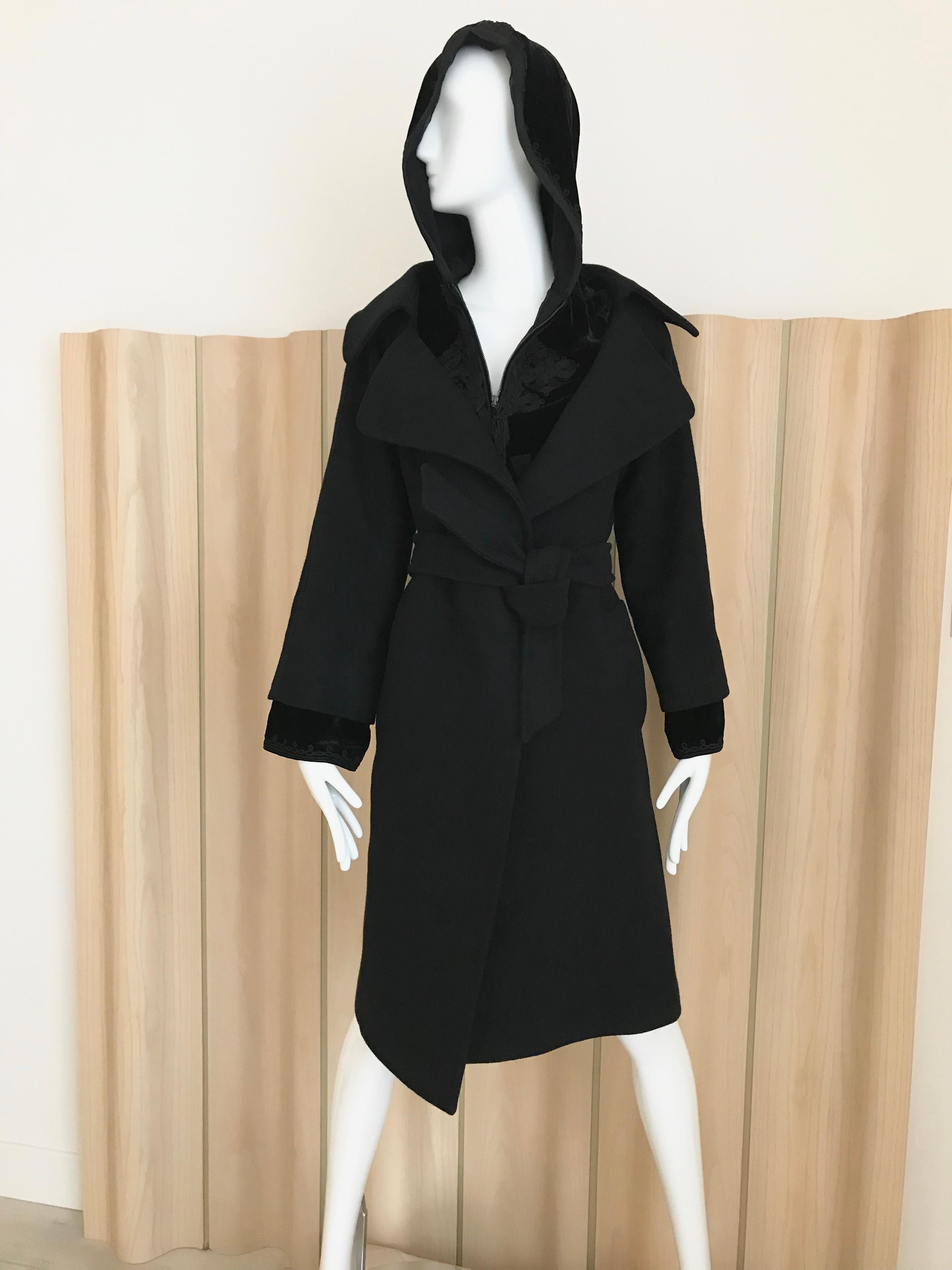Vintage Jean Paul Gaultier Black wool coat with velvet inner layer with zipper and hood.
Fit size: Modern US 6
Bust: 38 inches/ Hip 40 inches/ Coat length 39 inches/ sleeve length: 24 inches