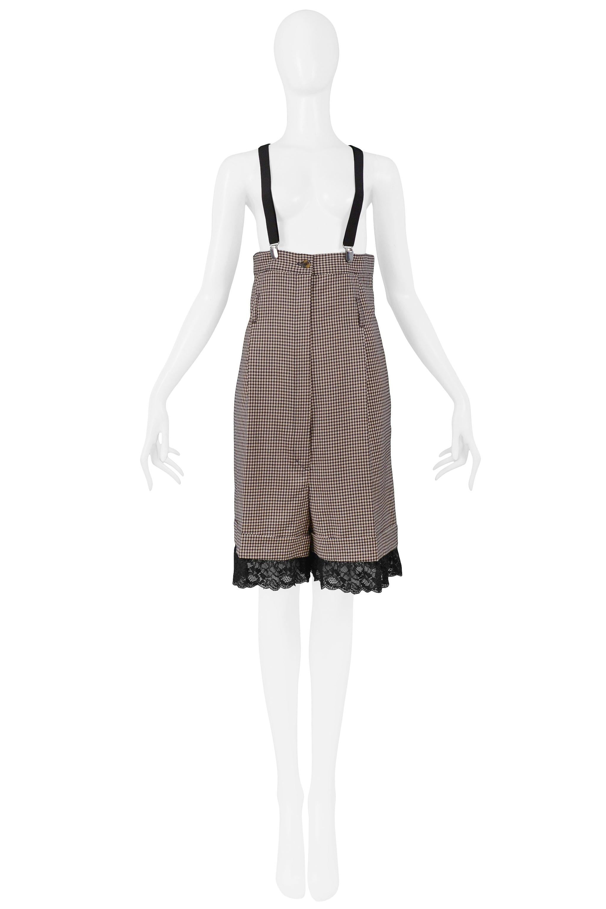 Resurrection is excited to offer a vintage Jean Paul Gaultier black and white check ultra-high waisted knee-length shorts with attached black suspenders and black lace at the hem.

Jean Paul Gaultier
Size 42
Wool Poly, Lace
2000 Collection
Excellent