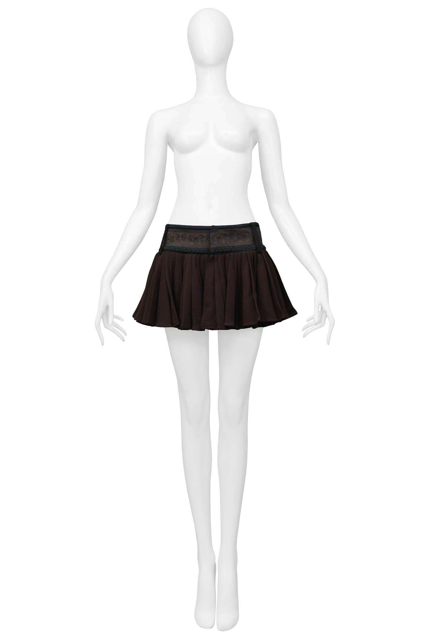 Resurrection Vintage is excited to offer a vintage Jean Paul Gaultier brown pleated skirt featuring embroidery and trim detailing, belt loops, and snap closure on the front of the skirt. Matching embroidered brocade blazer sold separately.

Jean