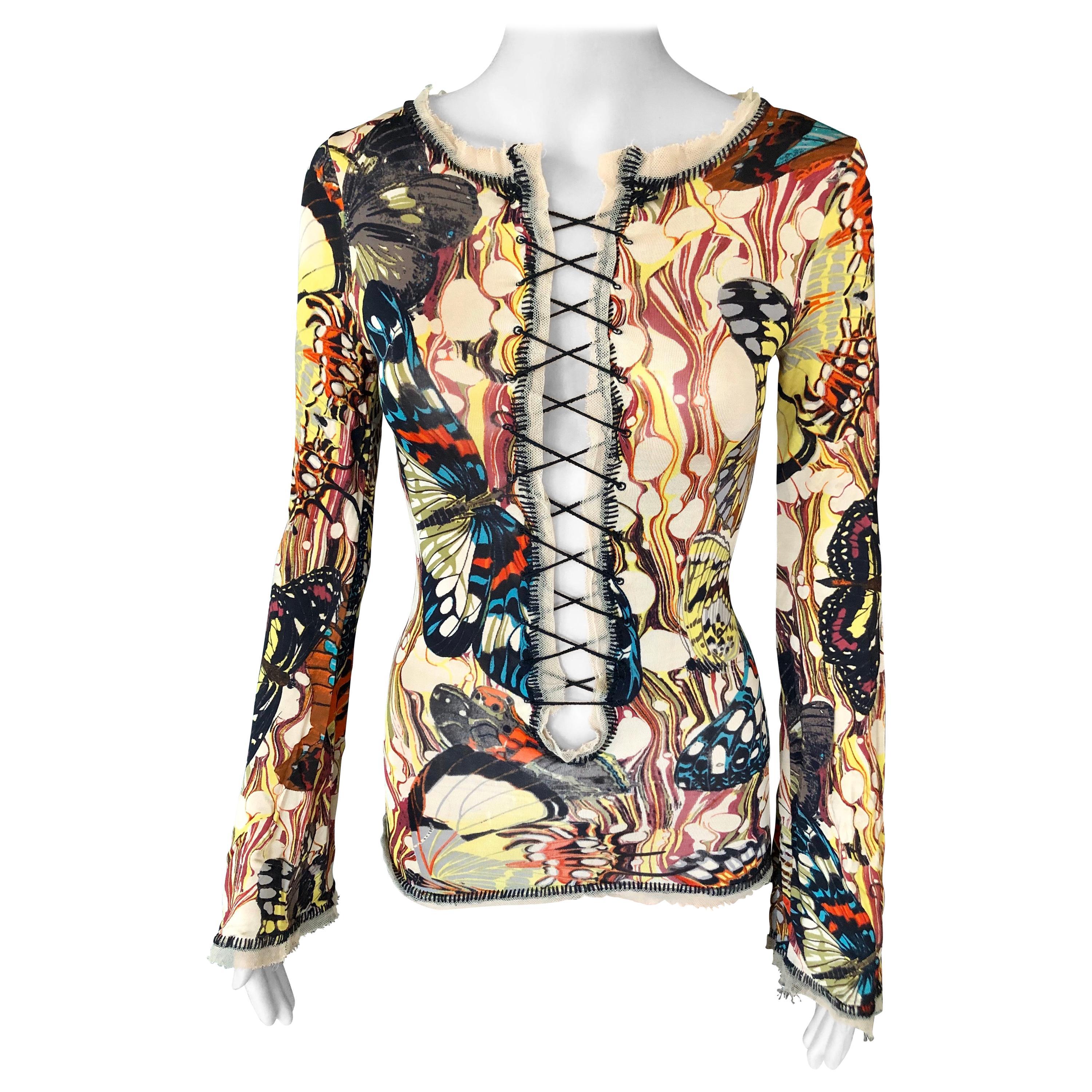 ¡Icónico top + falda estilo corsé de mariposa de Jean Paul Gaultier!
¡De la Colección Primavera-Verano 2003!

¡Uno de los mejores patrones de Jean Paul Gaultier!
Como se ha visto en Kendall Jenner y Chloe Cherry de Euphoria.
Precioso estampado
