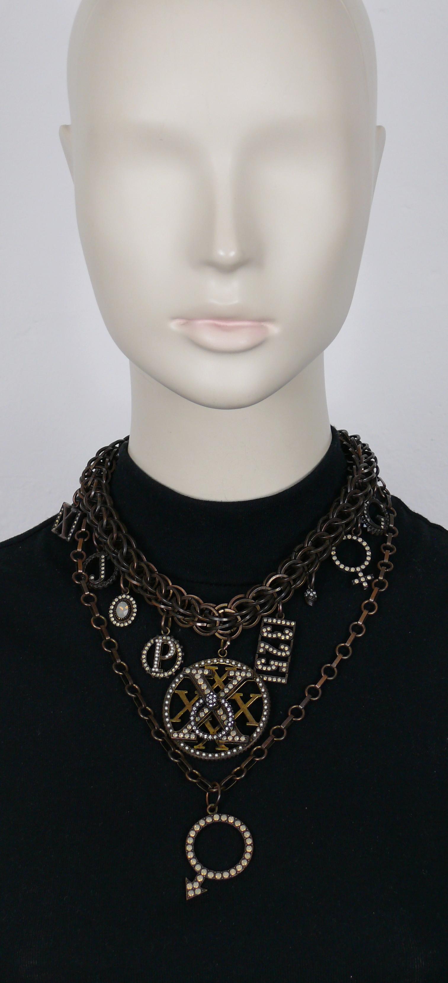 JEAN PAUL GAULTIER chunky antiqued bronze tone chain necklace featuring various charms embellished with opalescent crystals, clear crystals and faux pearls.

Secure push clasp closure.

J P G inital charms.
Unmarked.

Indicative measurements :