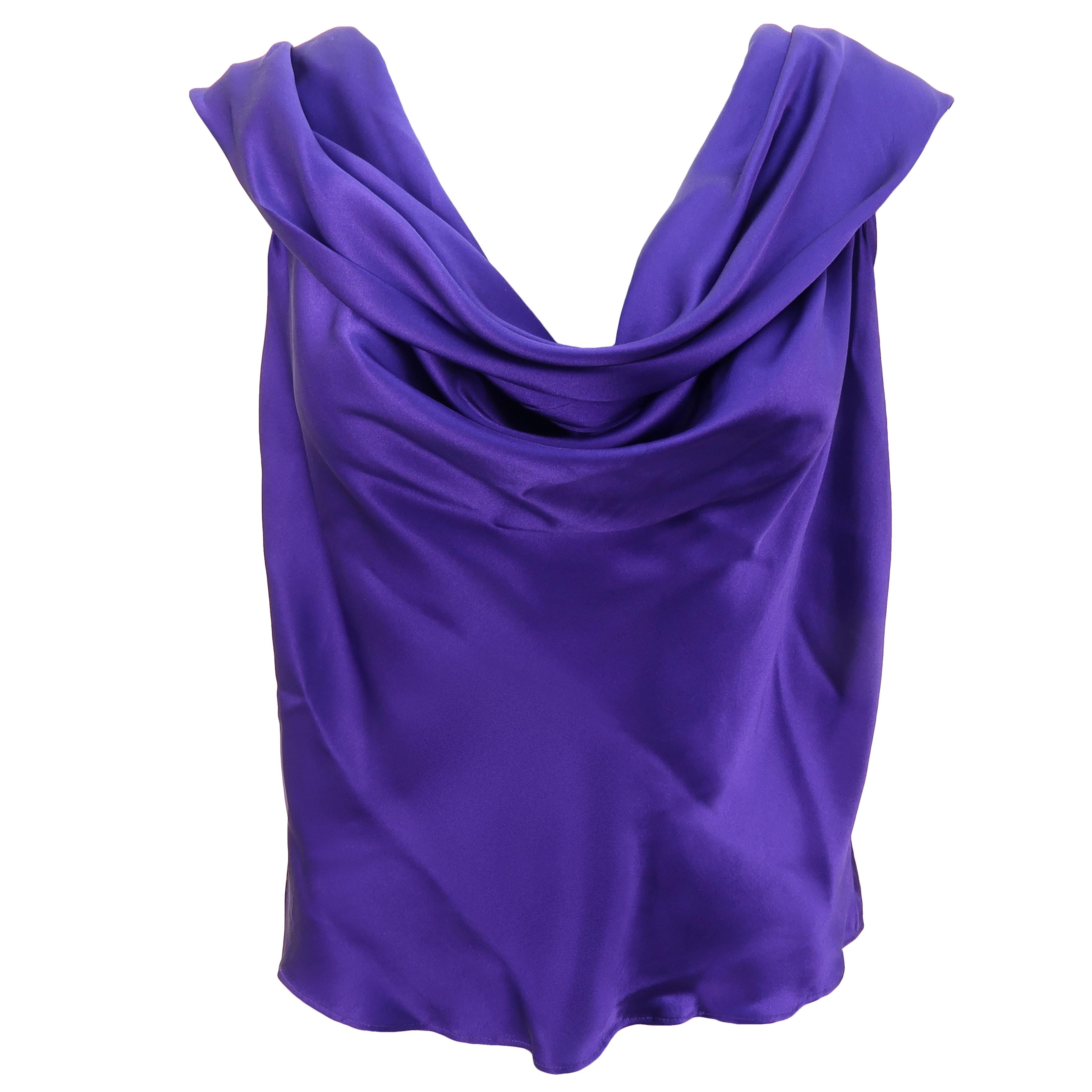 Another illustration of Gaultier’s technical skills when it comes to ‘flou’ territory, the opposite of all things tailored and constructed, this sensually cross draped silk top is luxurious and feminine, done in a subtle shade of lavender blue silk.
