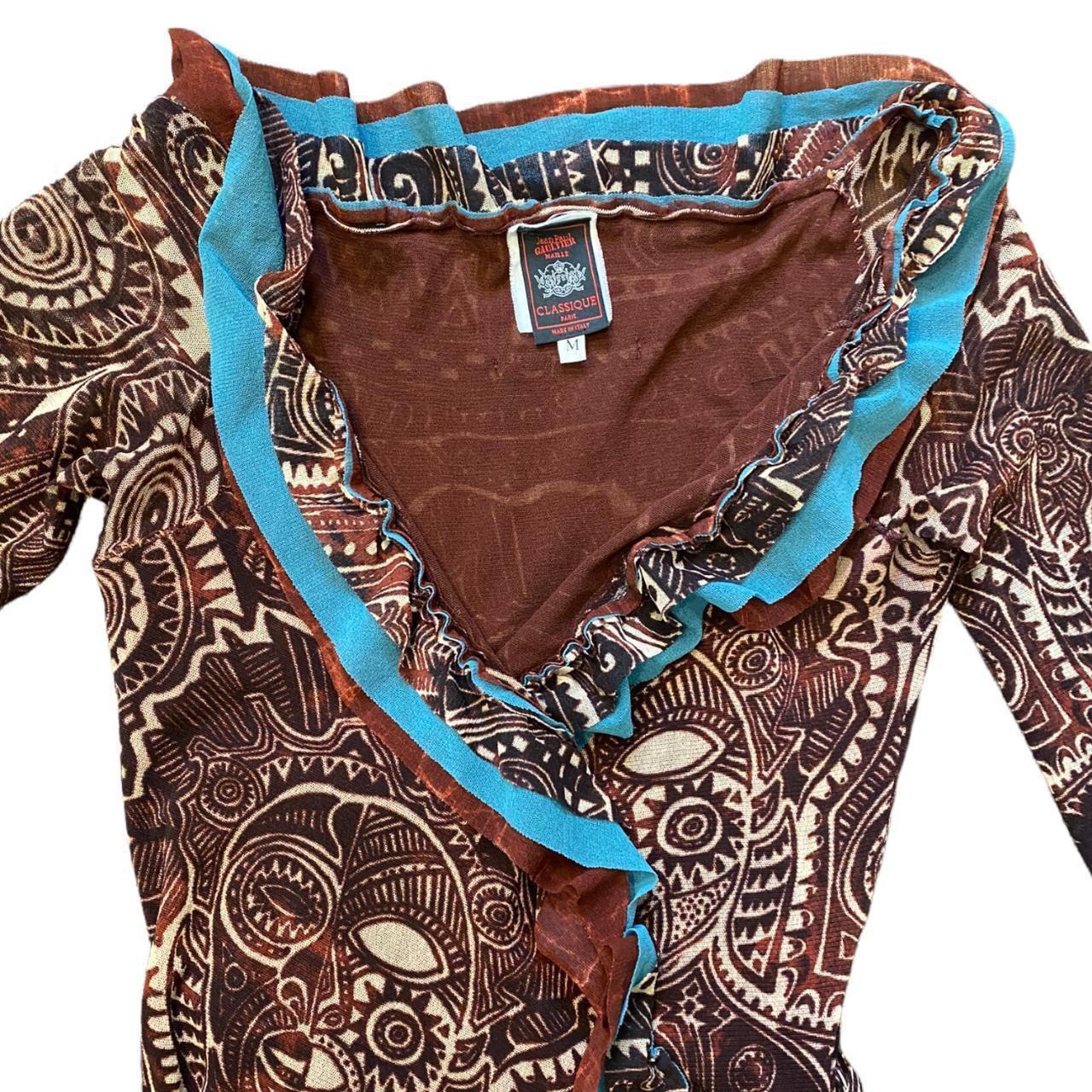 Jean Paul Gaultier Classique Dress

1990's Vintage Tribal Aztec Tattoo Print

Wrap Dress

Lightweight Stretchy Silky Mesh Material 

100% Authentic

SIZE: M 

ACTUAL MEASUREMENTS:  Shoulder to Hem: 39
