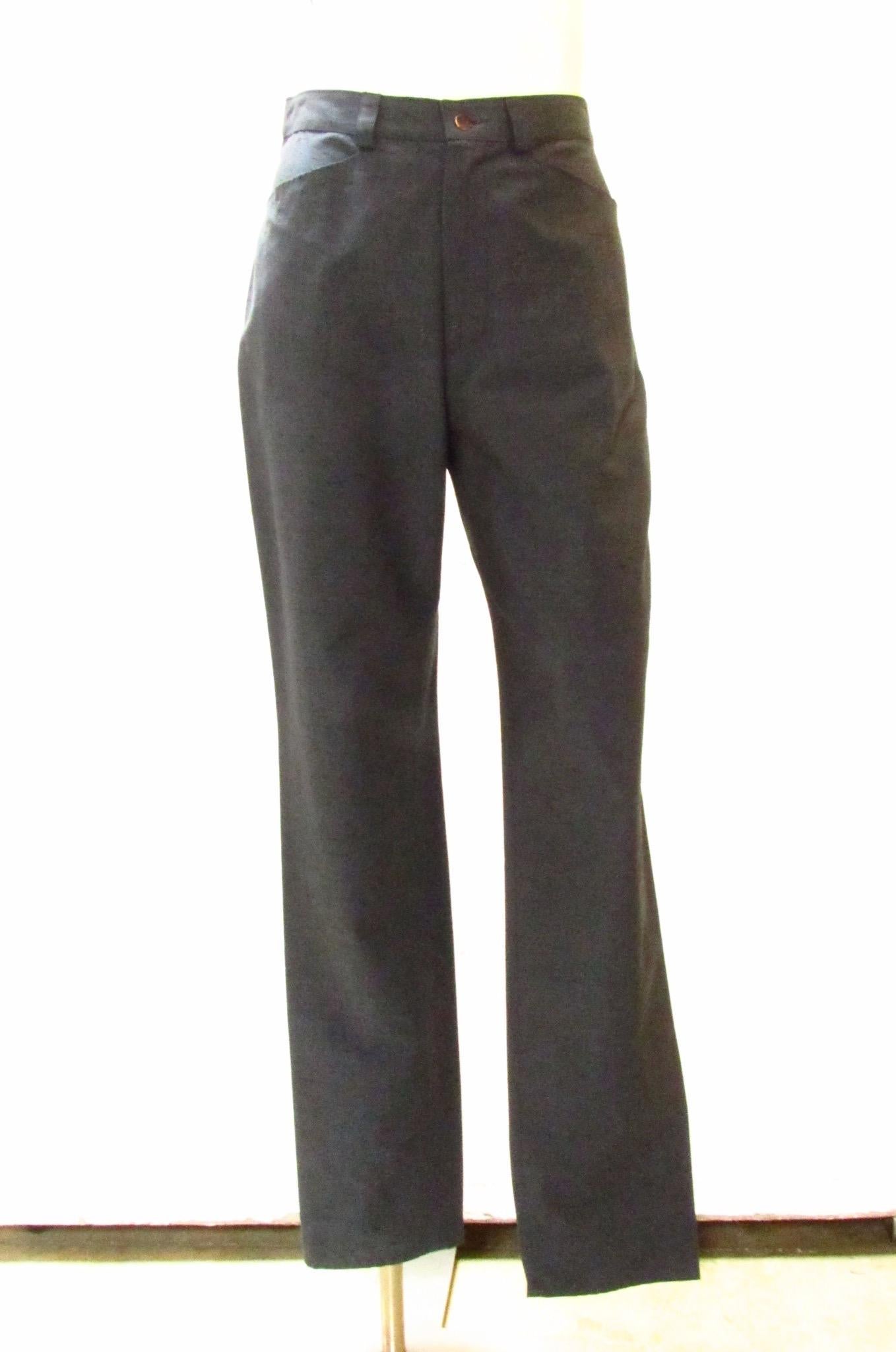 Vintage Jean Paul Gaultier Classique pant comes in a grayish blue lightweight rayon. These pants have all the styling of your favorite jeans (belt loops, zippered fly, front and back pockets), but in a more stylish and comfortable linen-look.
