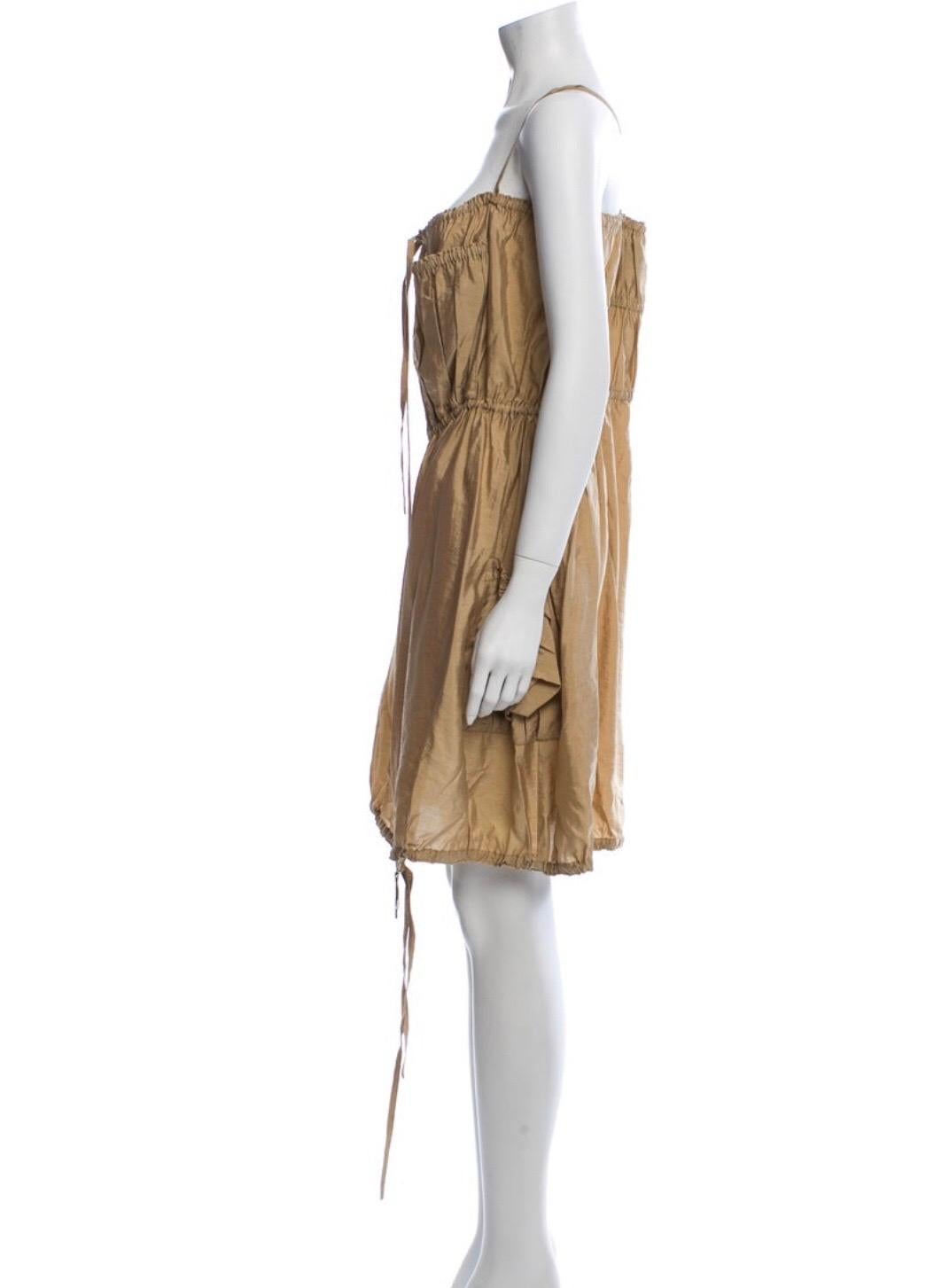 Jean Paul Gaultier Classique silk dress with zipper, drawstrings and cross cross straps. Condition Excellent. Size M / US 6 / IT 42
Waist: 30