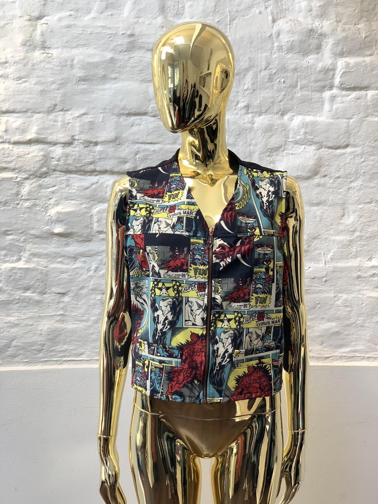 Jean Paul Gaultier Comic Print Waistcoat made in France from cotton. 

Jean Paul Gaultier disrupted the rarefied world of couture with his transgressive vision of beauty.

Inspired by punks, burlesque, screen goddesses, gender-benders, fetishists