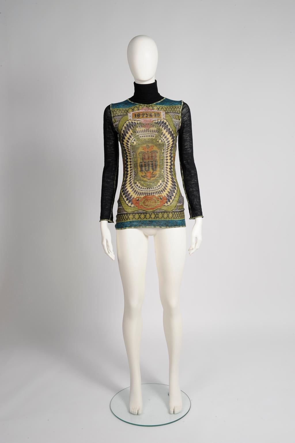 Modelled by Kate Moss on the Fall-Winter 1994-1995 runway in another color range (see pictures 3 & 4), this Jean-Paul Gaultier turtleneck sweater top is cut for a close fit. Made of 100% lightweight stretchy wool mesh, it has the recognizable (and