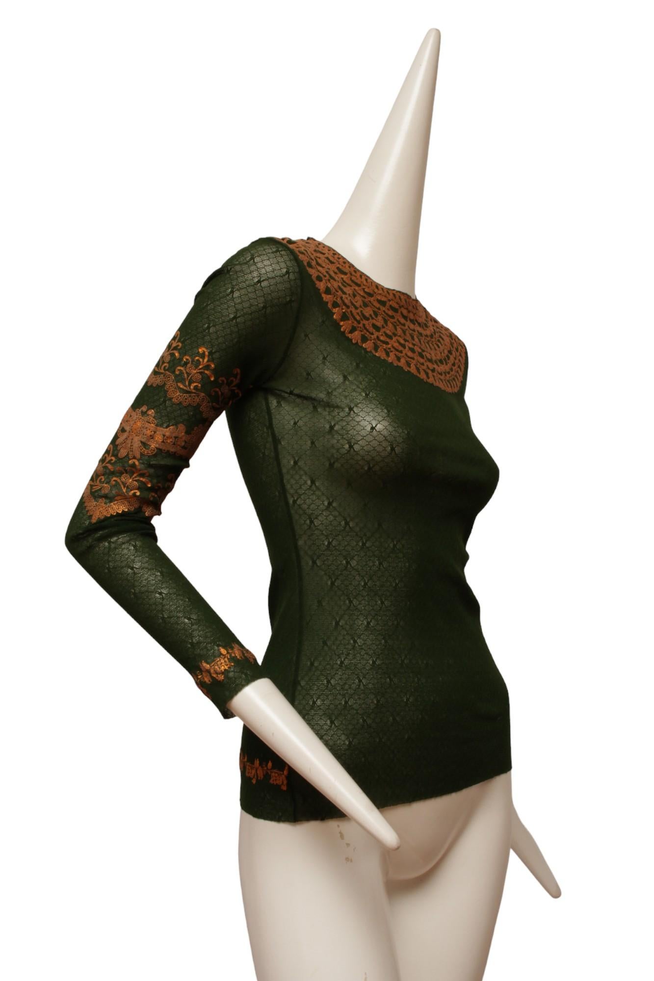 Jean Paul Gaultier Maille Iconic Mesh Long Sleeve Top with a metallic gold design on front and sleeves. 

Made in Italy

Size Small Measurements: Shoulder 16