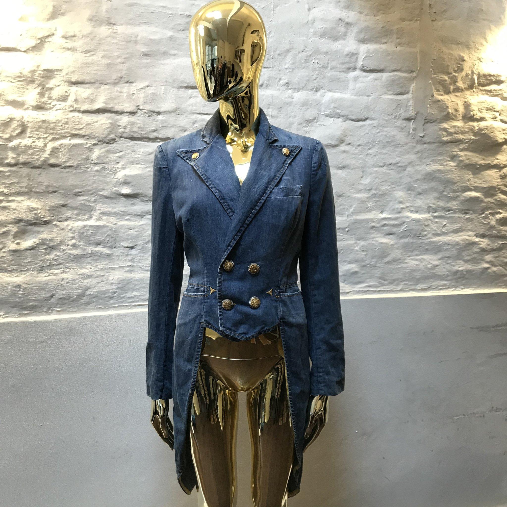 Jean Paul Gaultier Denim Dinner Jacket made in France. 

Jean Paul Gaultier disrupted the rarefied world of couture with his transgressive vision of beauty.

Inspired by punks, burlesque, screen goddesses, gender-benders, fetishists and subcultures