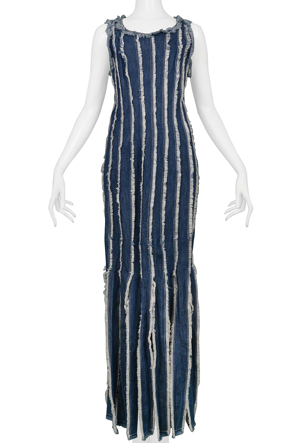 Resurrection Vintage is excited to offer a vintage Jean Paul Gaultier blue denim dress featuring vertical panels with raw edges that detach at skirt hemline which creates a fringe effect, a scoop neckline, side zipper, and maxi-length. 

Jean Paul