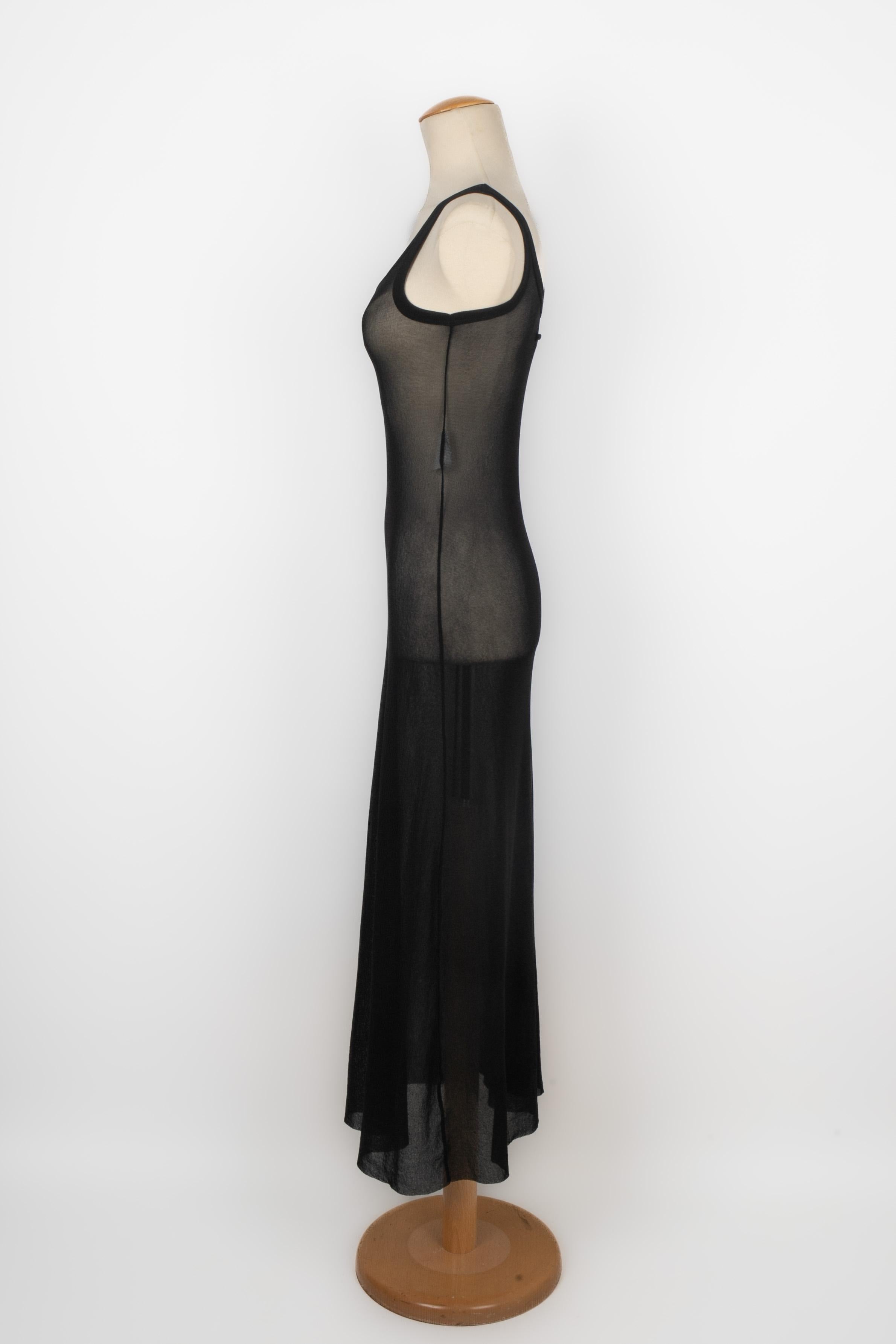 JEAN-PAUL GAULTIER - (Made in Italy) Long transparent black mesh dress. Size S indicated.

Condition:
Very good condition

Dimensions:
Chest: 36 cm - Waist: 33 cm - Hips: 46 cm - Length: 130 cm

SKU:VR259