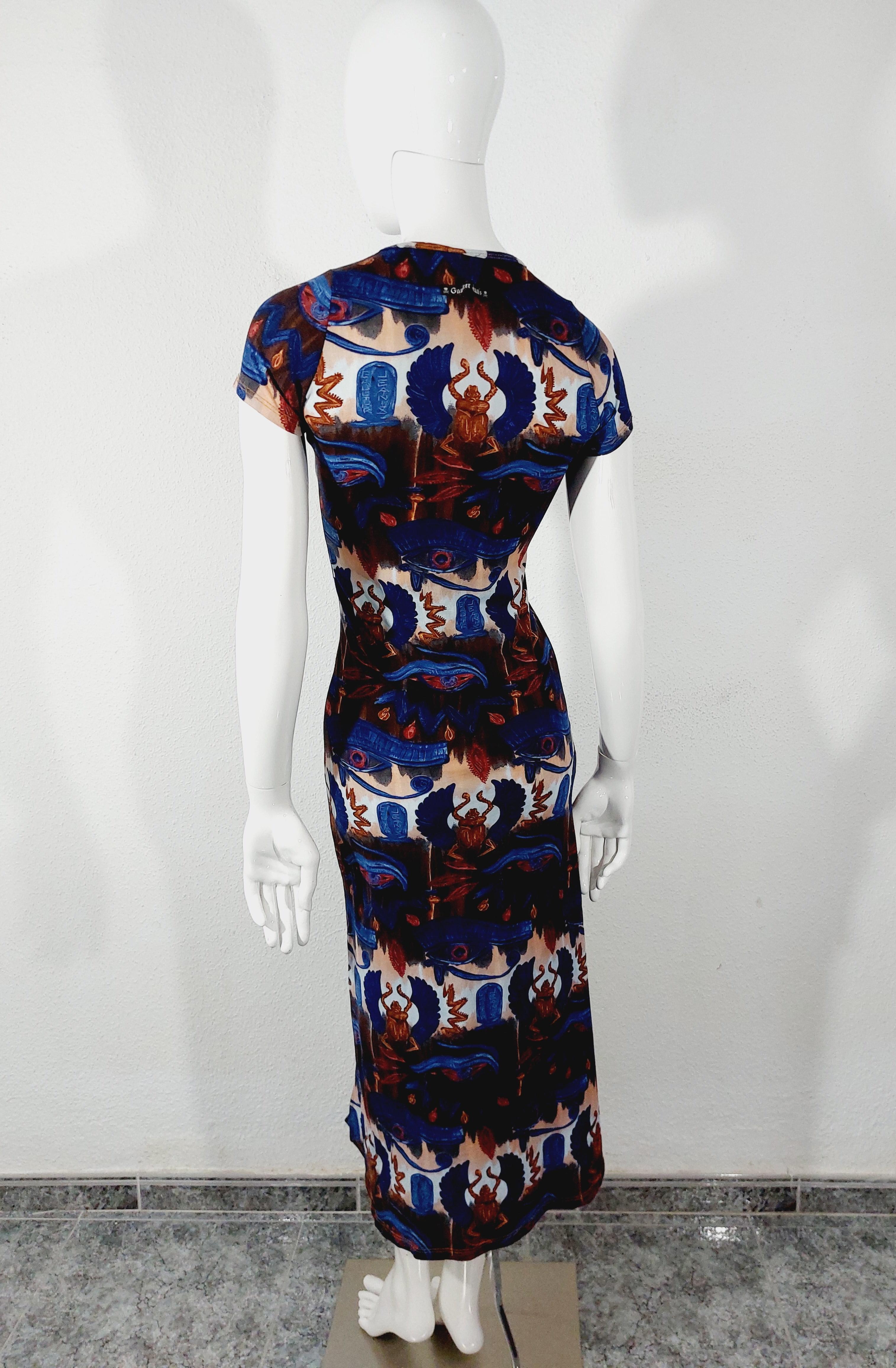 Jean Paul Gaultier Egypt SS 1997 Eye of Horus Scarab Hieroglyph Print Maxi Dress

Incredible vintage Jean Paul Gaultier dress, from Spring/Summer 1997. Featuring an iconic print consisting of Egyptian inspired imagery- the Eye of Horus, scarabs,