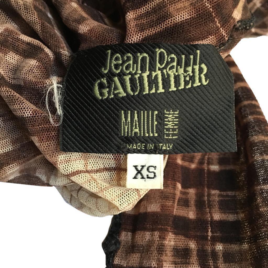 Jean Paul Gaultier Turtleneck Long Sleeves Top with  Brown checkered Greta Garbo print (both back and front), from the Fall/Winter 2001 collection.

Size label XS, fits bigger sizes as well.

Measurements:

Shoulder to shoulder - 37 cm / 14,5
