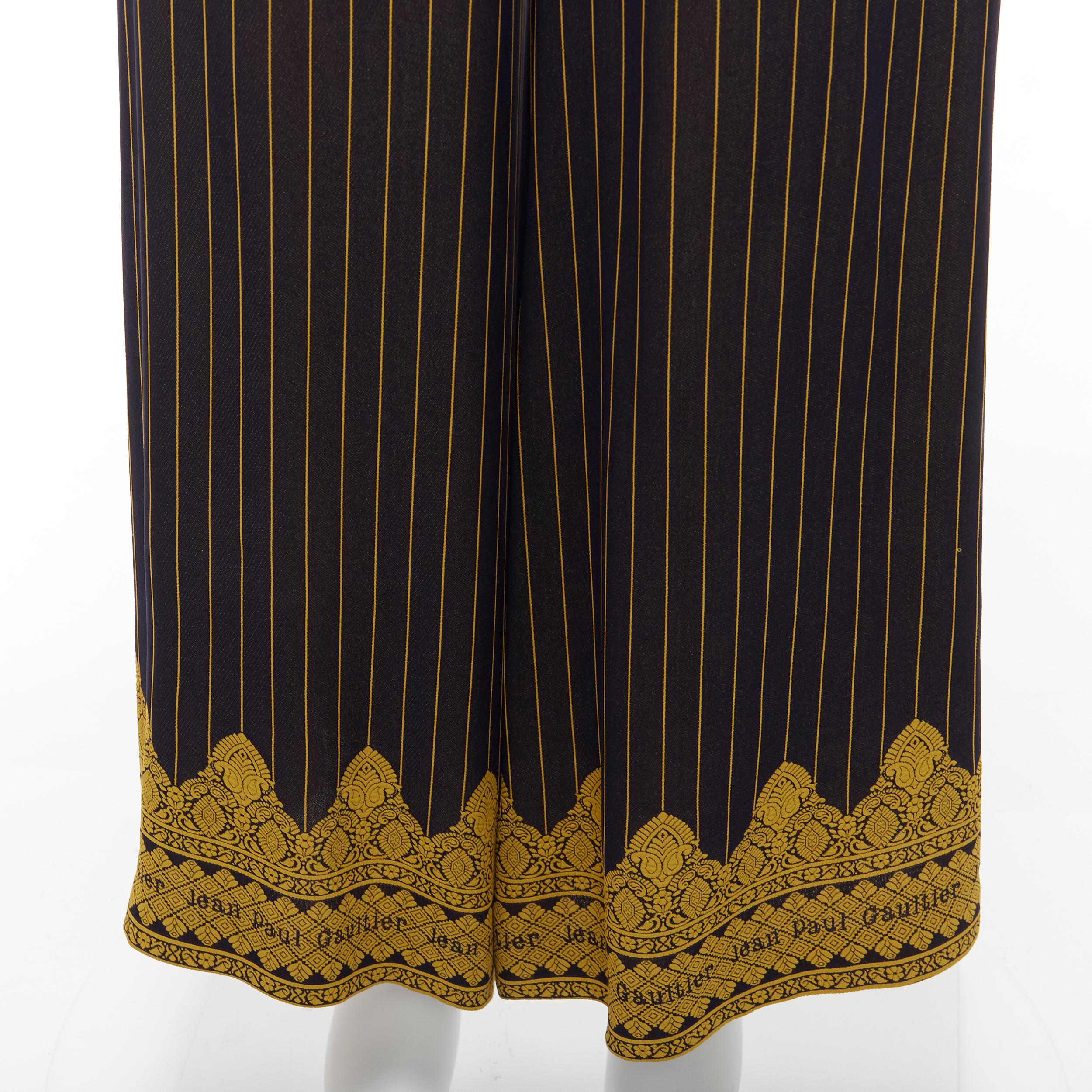 JEAN PAUL GAULTIER FEMME black gold striped logo trim wide leg pants IT40 L
Reference: CNLE/A00295
Brand: Jean Paul Gaultier
Designer: Jean Paul Gaultier
Collection: FEMME
Color: Black, Gold
Pattern: Striped
Closure: Zip
Extra Details: Side