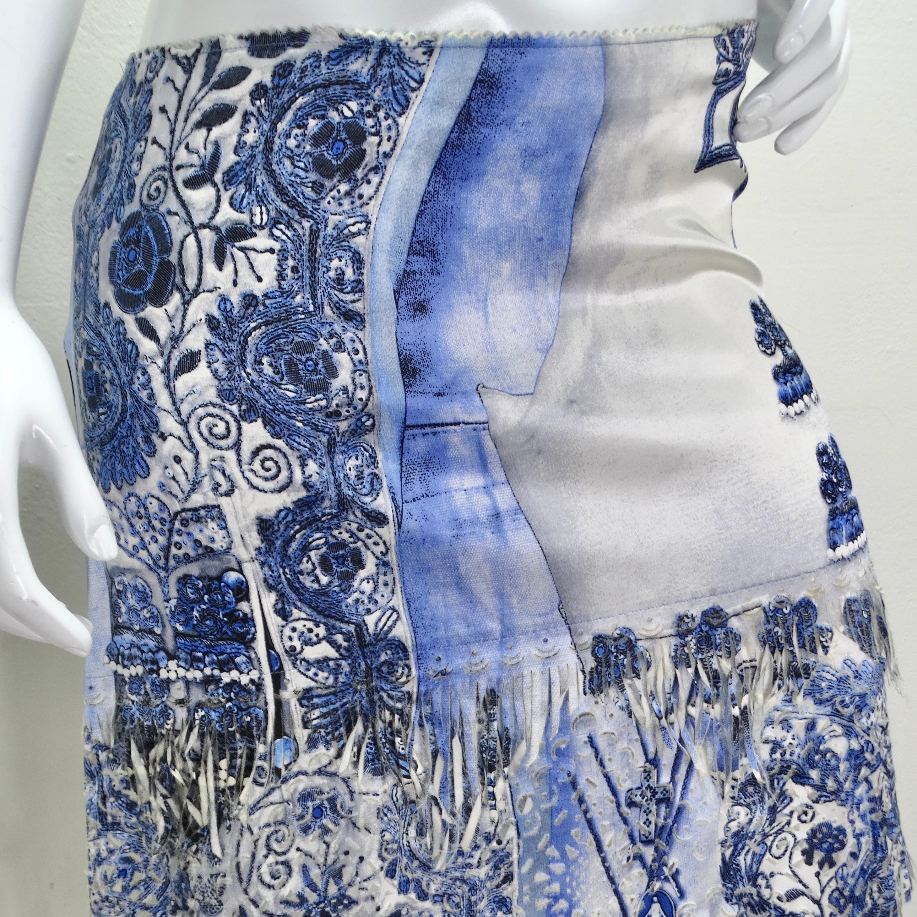 Step into the realm of avant-garde fashion with the Jean Paul Gaultier Femme Embroidered Fringe Skirt, a captivating piece that embodies the bold creativity of the early 2000s. This unique skirt features a distinctive blue and white femme print,