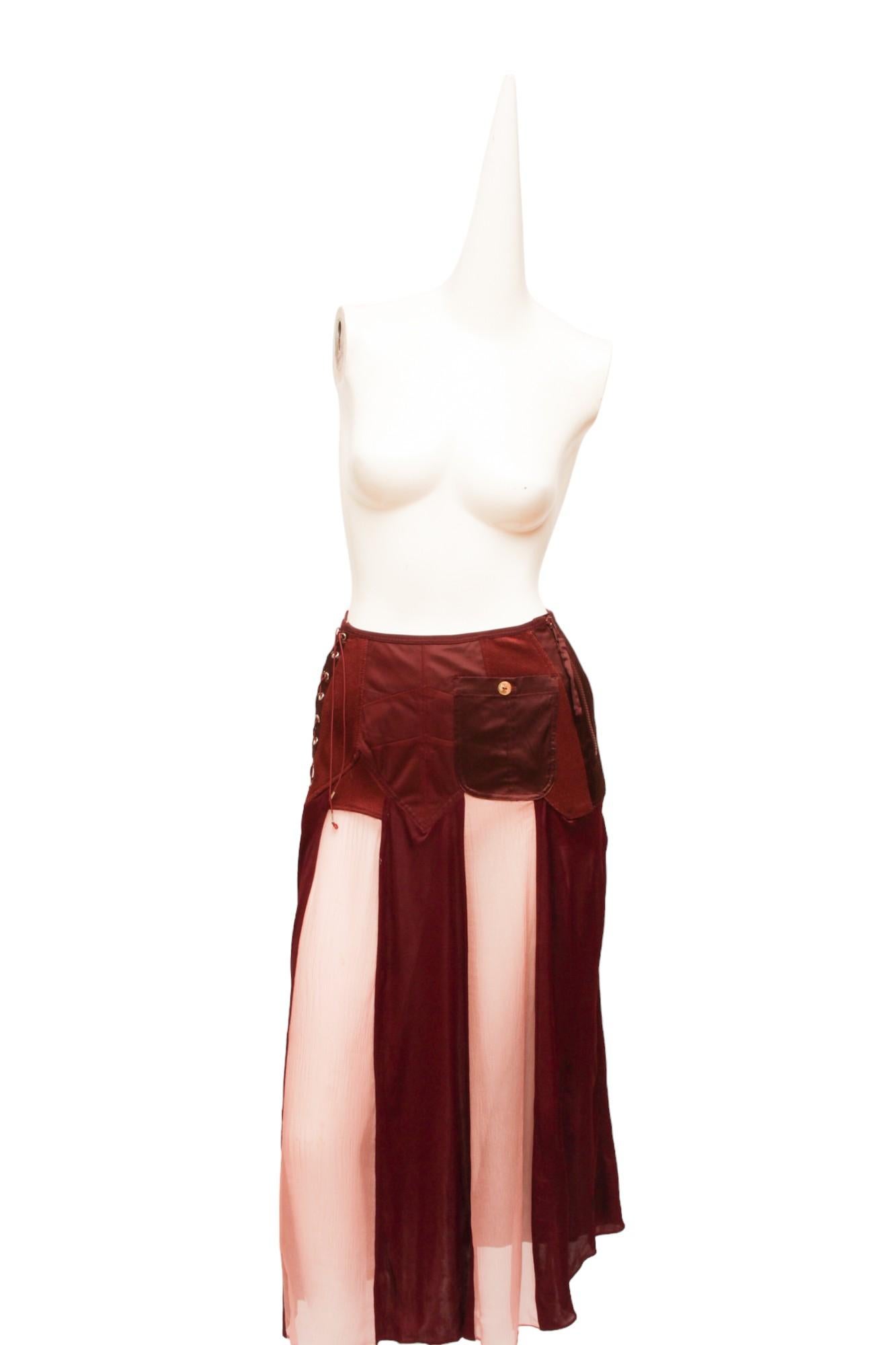 Jean Paul Gaultier Femme Maroon Lace and Zip-up Panel skirt with pink silk panels. Small Pocket on the front with a shell button.

Measurements: Waist 24
