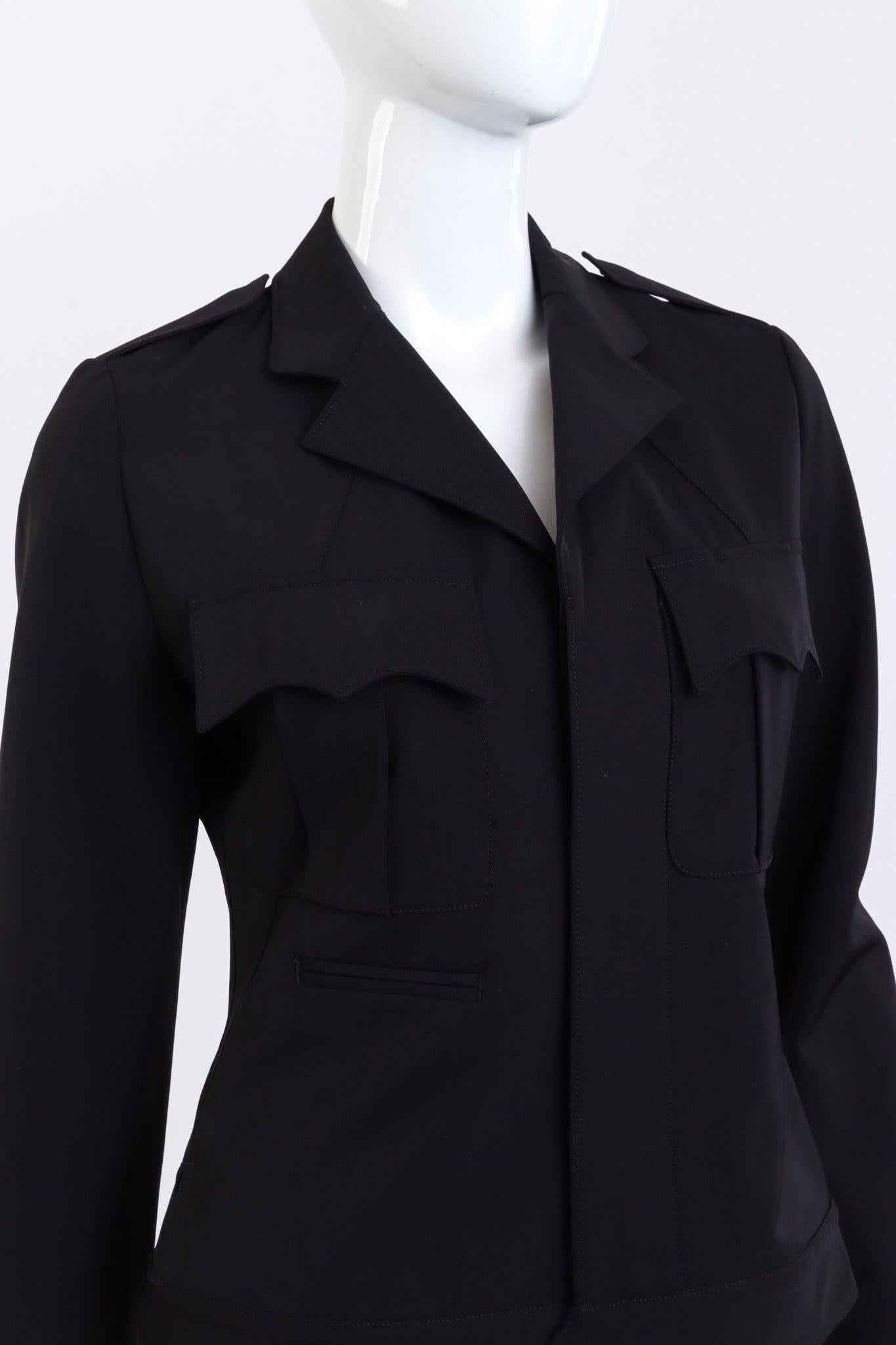 JEAN PAUL GAULTIER FEMME OPEN BACK BLAZER JACKET (US 6)

This Jean Paul Gaultier Femme blazer features a structured open-back design with exposed shoulders and a draped cowl back. Tailored with a peak lapel and princess-seamed body, it has a