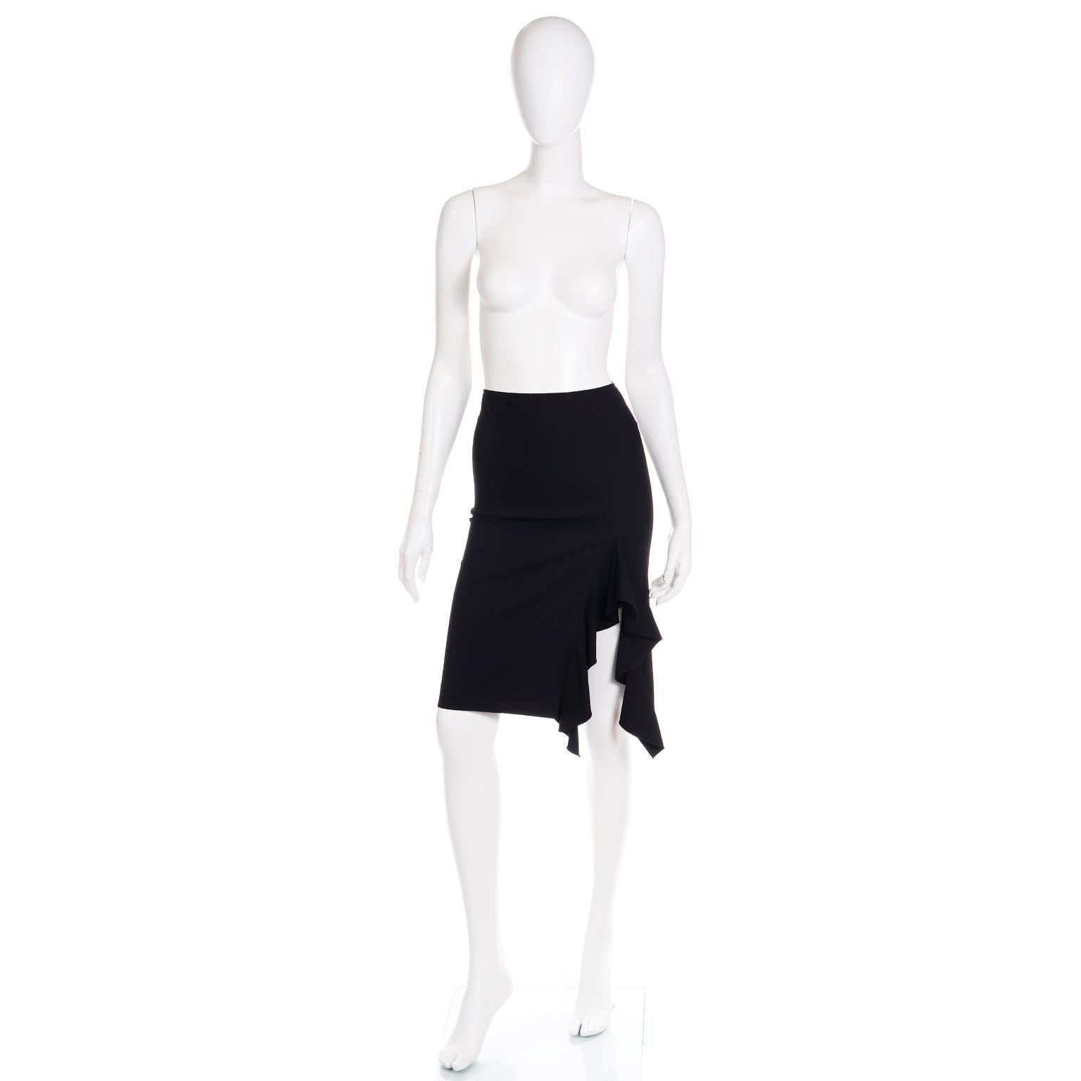 This is an early 2000's Jean Paul Gaultier Femme black bodycon wool blend straight skirt with slight stretch. We especially love the 13