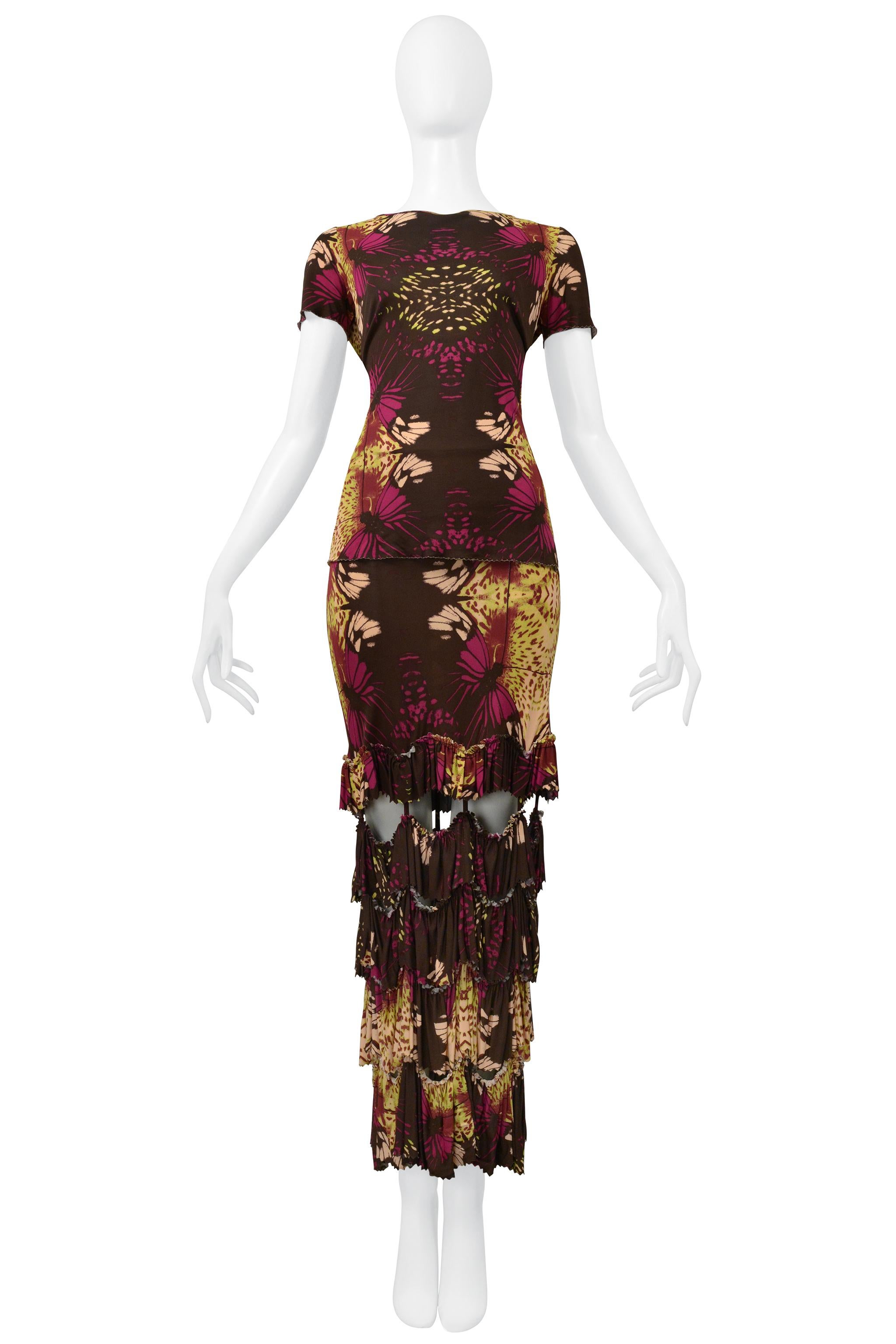 Resurrection Vintage is excited to present a vintage Jean Paul Gaultier brown jersey top and skirt ensemble. This ensemble features a floral print, a classic t-shirt body, and a long skirt with an elastic waistband, tiered ruffles, and