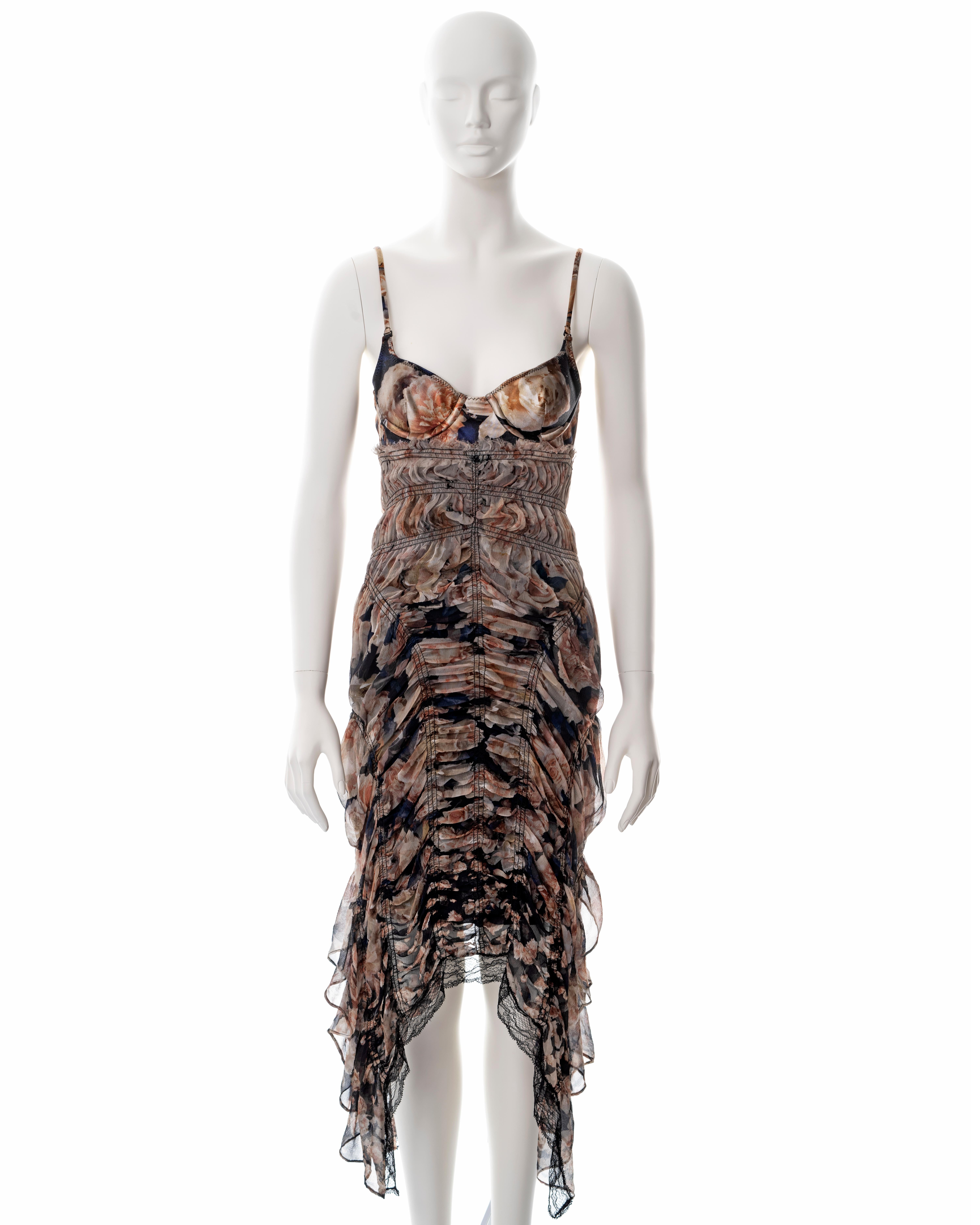 ▪ Jean Paul Gaultier floral printed smocked silk dress
▪ Sold by One of a Kind Archive
▪ Spring-Summer 2011
▪ Integrated bra with adjustable shoulder straps 
▪ Asymmetric hemline 
▪ Black lace trim
▪ FR 36 - UK 8 - US 6
▪ Made in Italy

All