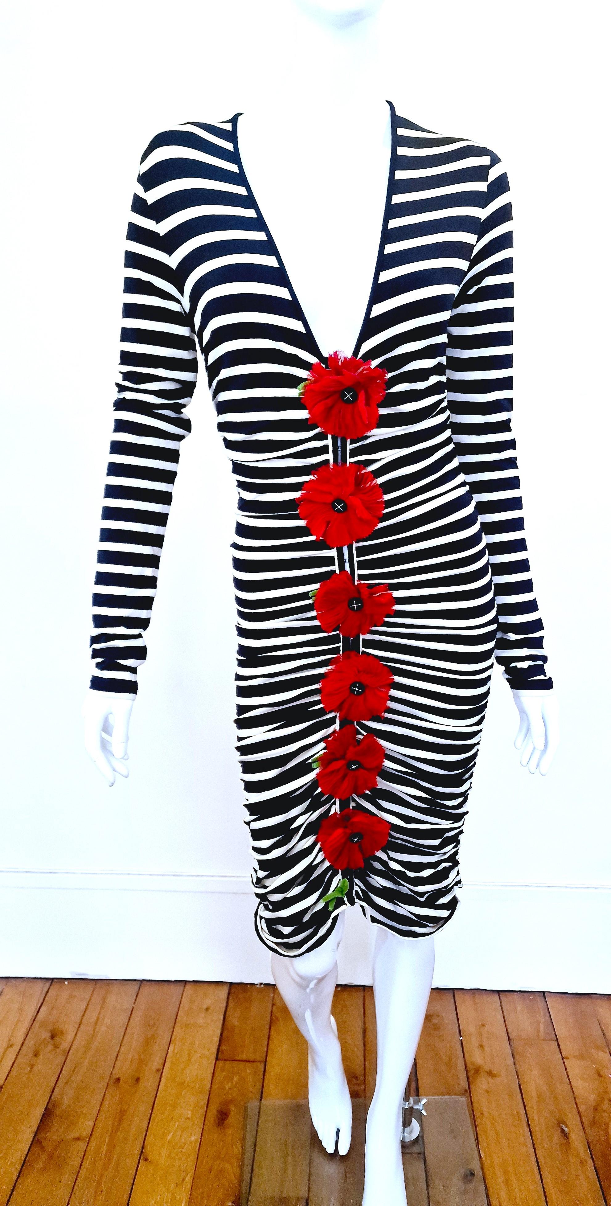 Beautiful sailor midi dress from Jean Paul Gaultier Soleil with s6 raw cutted 100% silk flowers applique on the front.
Closure: full clips on the front! 
Fabric is nicely stretch and fit beautifully the body as all the seams are ruched.

VERY GOOD