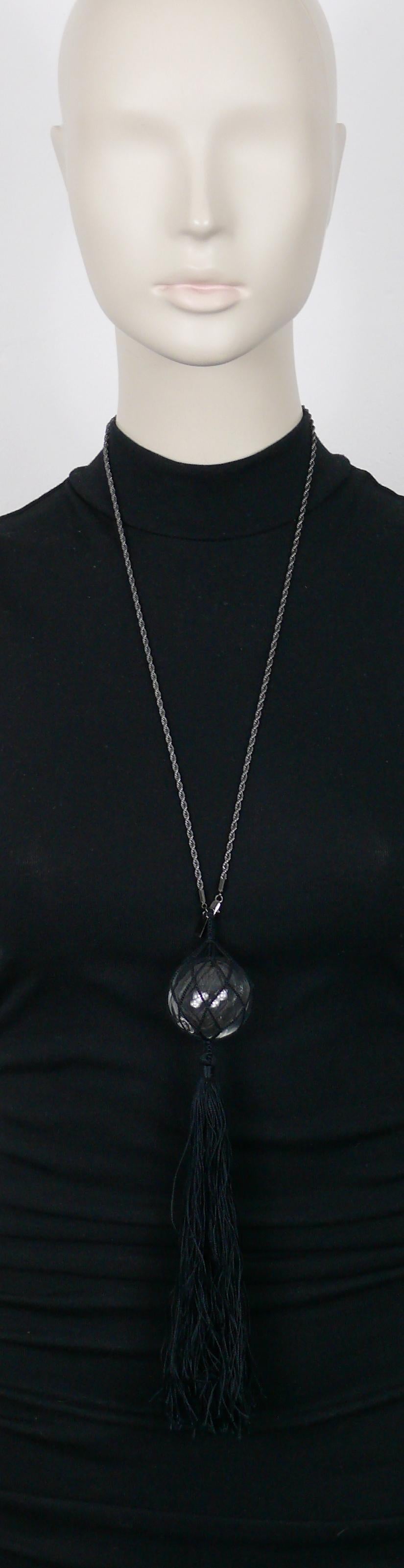 JEAN PAUL GAULTIER ruthenium color metal chain necklace featuring a clear glass ball net pendant and a long black tassel.

Slips on (no closure system).

Embossed JEAN PAUL GAULTIER.

Indicative measurements : wearable length (including tassel)