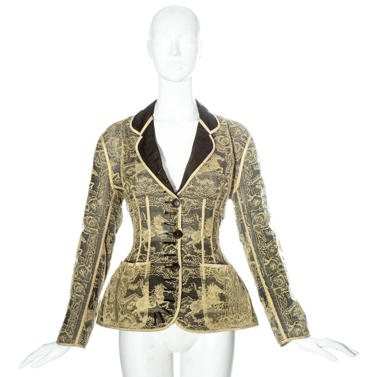 Jean Paul Gaultier gold lace corseted jacket backed with black silk organza. 

Spring-Summer 1988