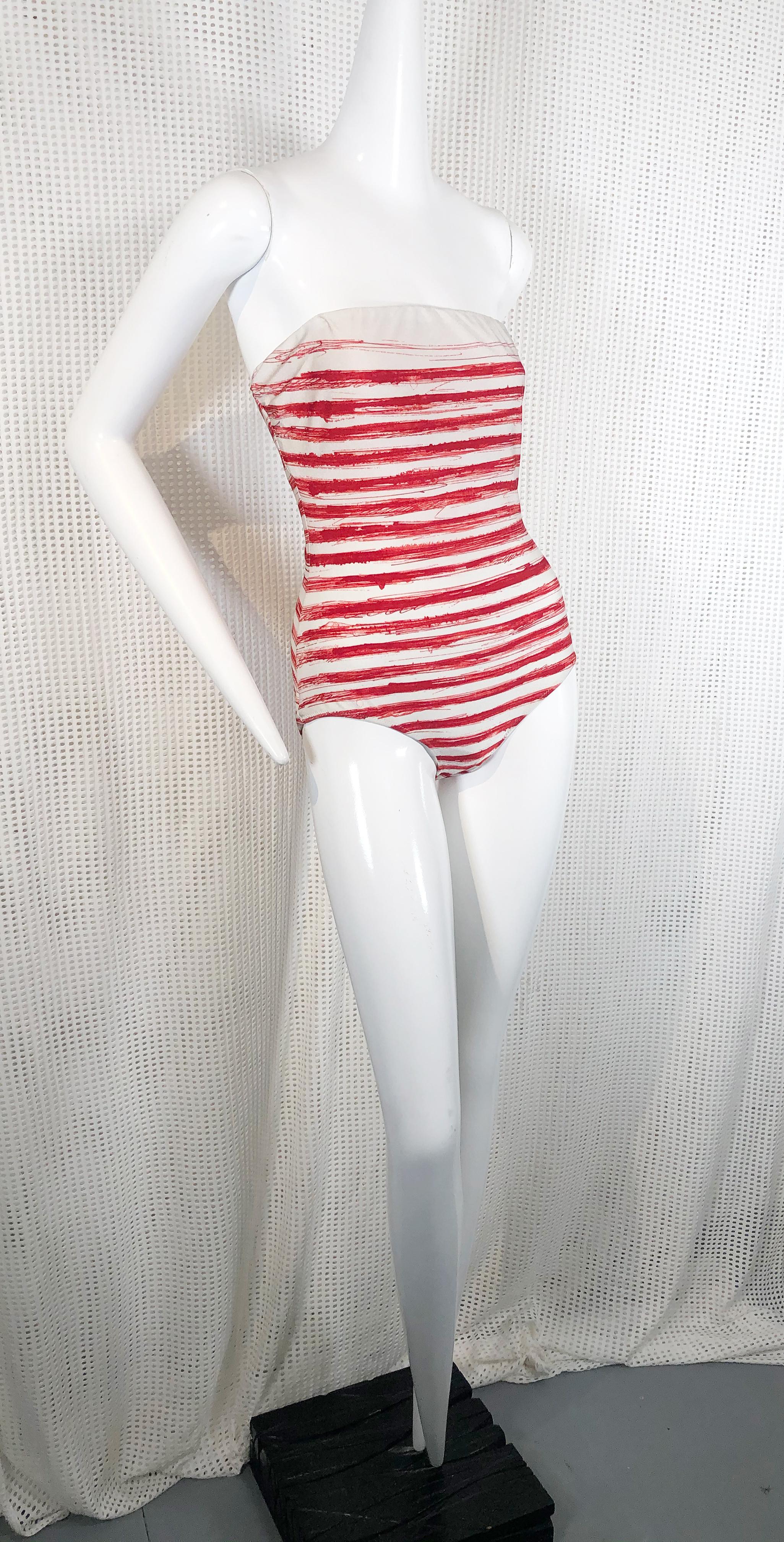 A great Jean Paul Gaultier Soleil label with graphic brush stroke red striped strapless one-piece swimsuit. French size 44. Fits a US size 2.
Condition: Very good.