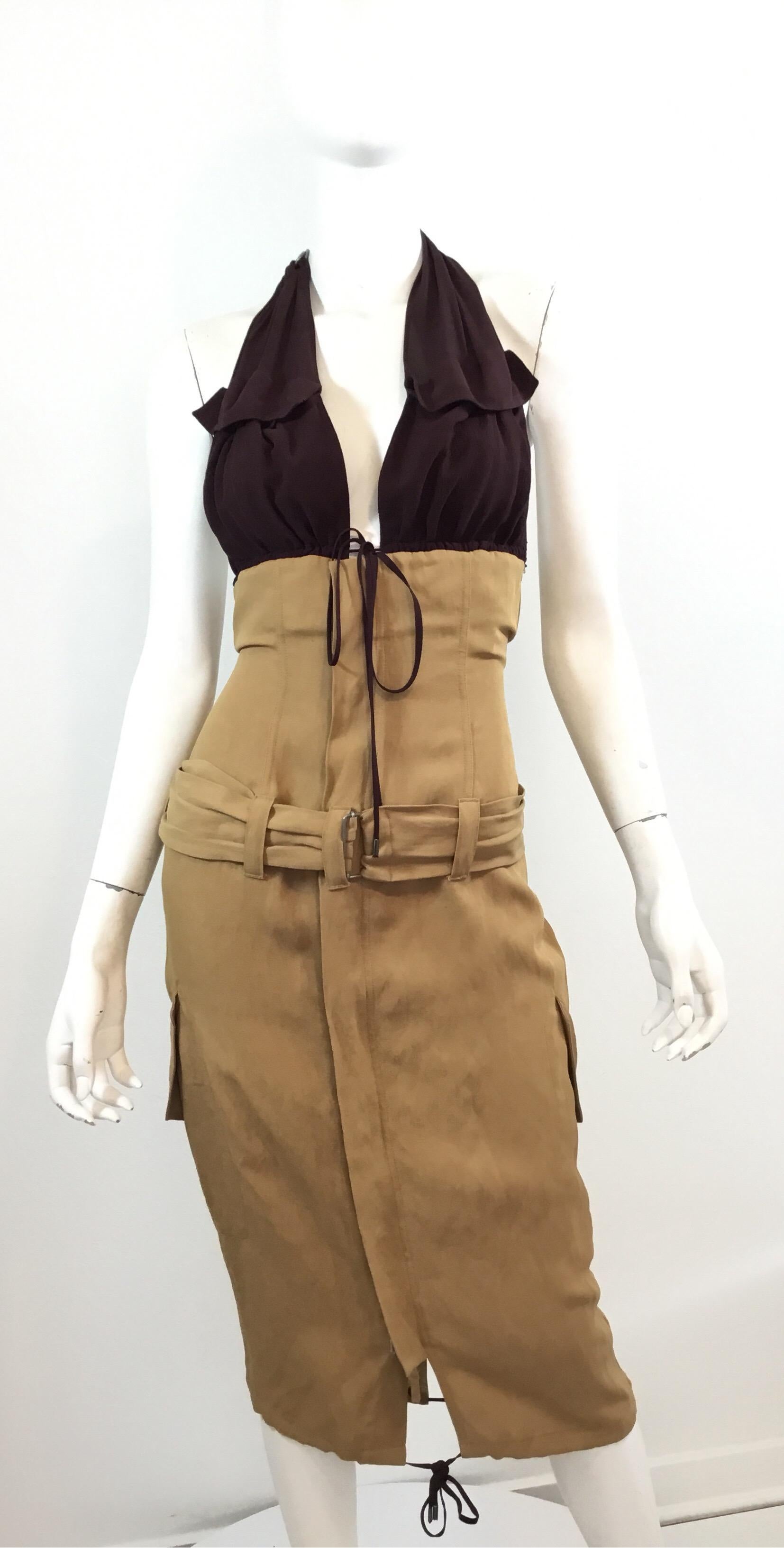 Jean Paul Gaultier dress featured in a khaki linen fabric with a burgundy silk halter top. Dress has ties at the bust and hem, belt fastening over a concealed zipper and snap button fastening, and flap pockets at the waist. Dress is labeled a size