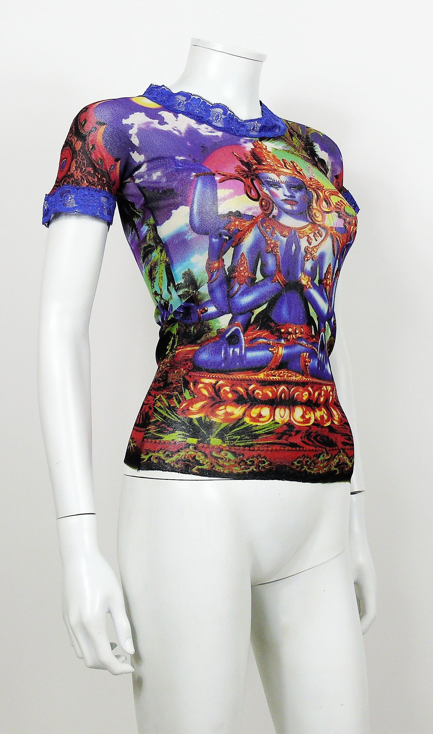 JEAN PAUL GAULTIER vintage sheer mesh top featuring an Hindu deity print in vibrant colors with lace detailing.

Label reads JEAN PAUL GAULTIER MAILLE CLASSIQUE Paris.
Made in Italy.

Size label reads : M.
Please refer to measurements.

Composition