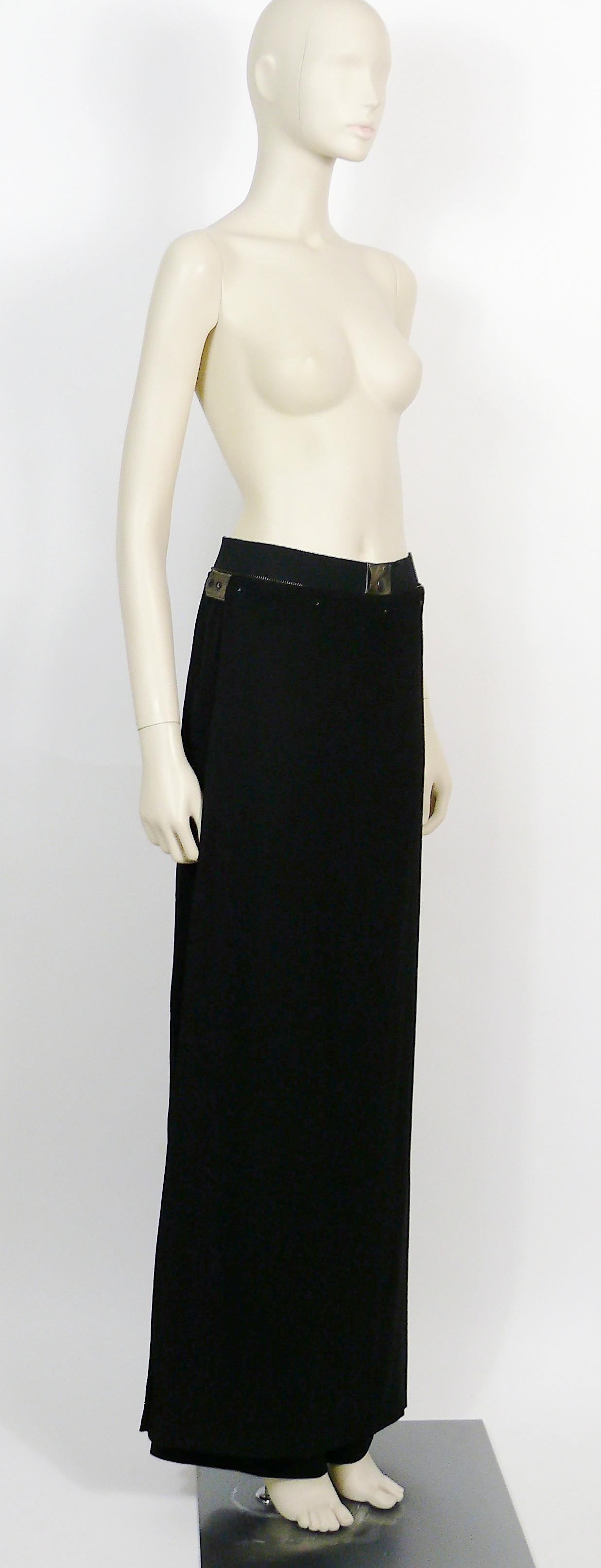 JEAN PAUL GAULTIER HOMME vintage rare black wool blend wrap skirt trousers for men.

These trousers feature :
- Black virgin wool blend trousers with a wrap skirt/apron.
- Wide elasticated waist band embellished with a half zipper.
- Front snap