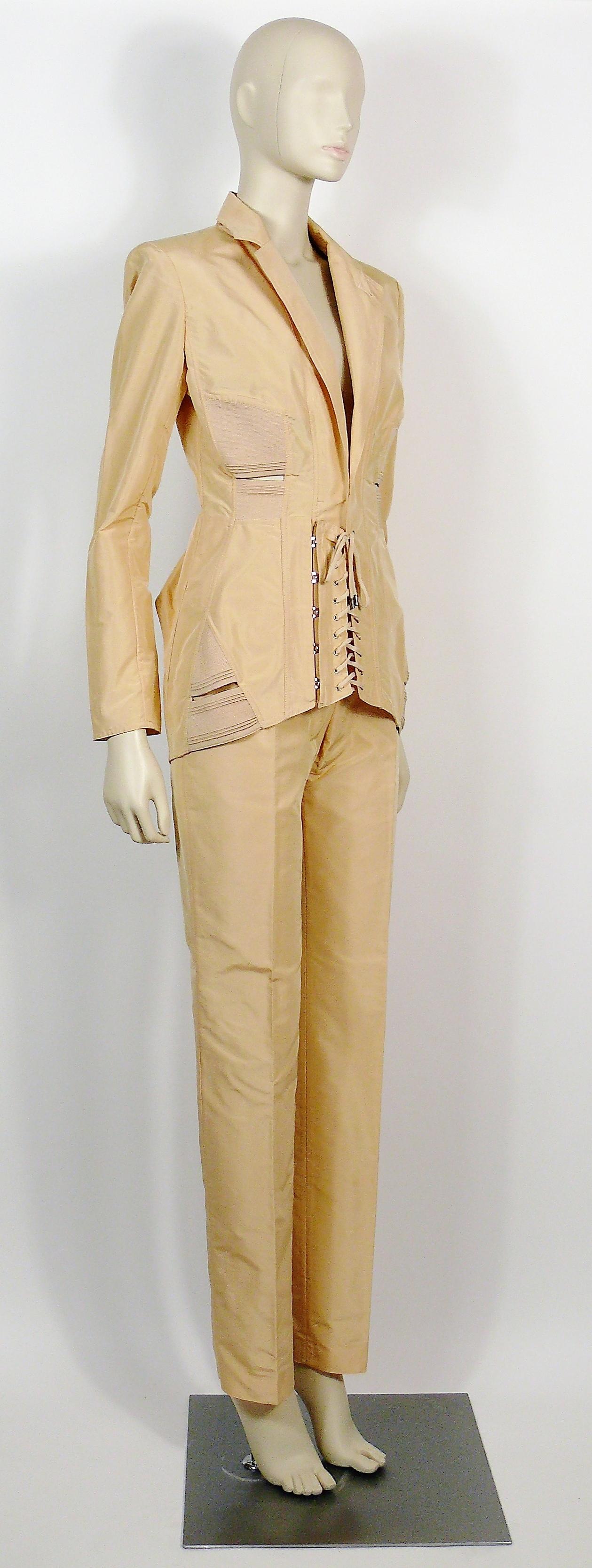 JEAN PAUL GAULTIER iconic vintage peach corset-inspired blazer and pant suit.

BLAZER features :
- Long sleeves.
- Lapel collar. 
- Front corset lacing closure front.
- Elastic insets at side and back.
- Elasticized cut-out at side and back.
-