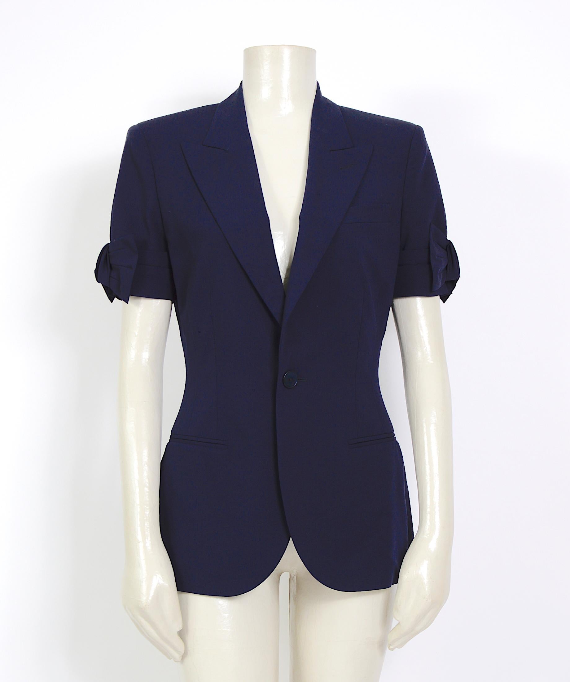 Gorgeous vintage 1990s blue jacket by Jean Paul Gaultier. The short sleeves feature a bow.
Made in a mix of 80% wool and 10% polyamide. the lining of the jacket is 100% silk.
Size: USA 8 - Italy 42 - French 38 - UK 10
Please use the measurements