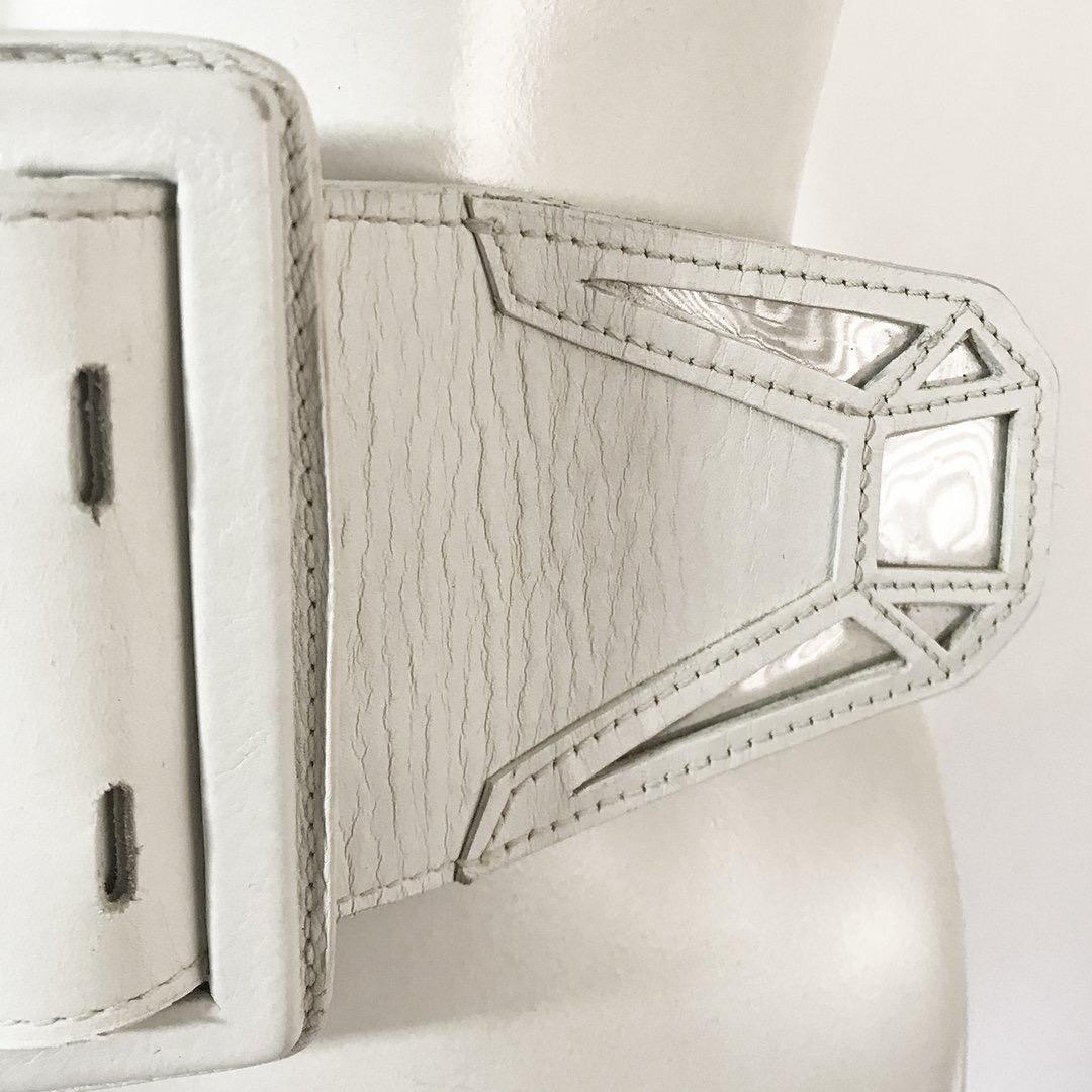 Vinyl inlay laser-cut belt by Jean Paul Gaultier 
Smooth calfskin leather
Laser cut details with clear vinyl inlaid panels
Silver-tone hardware 
Made in Italy
Condition: Very good condition, slight wrinkling on leather and a few spots. (See photos)