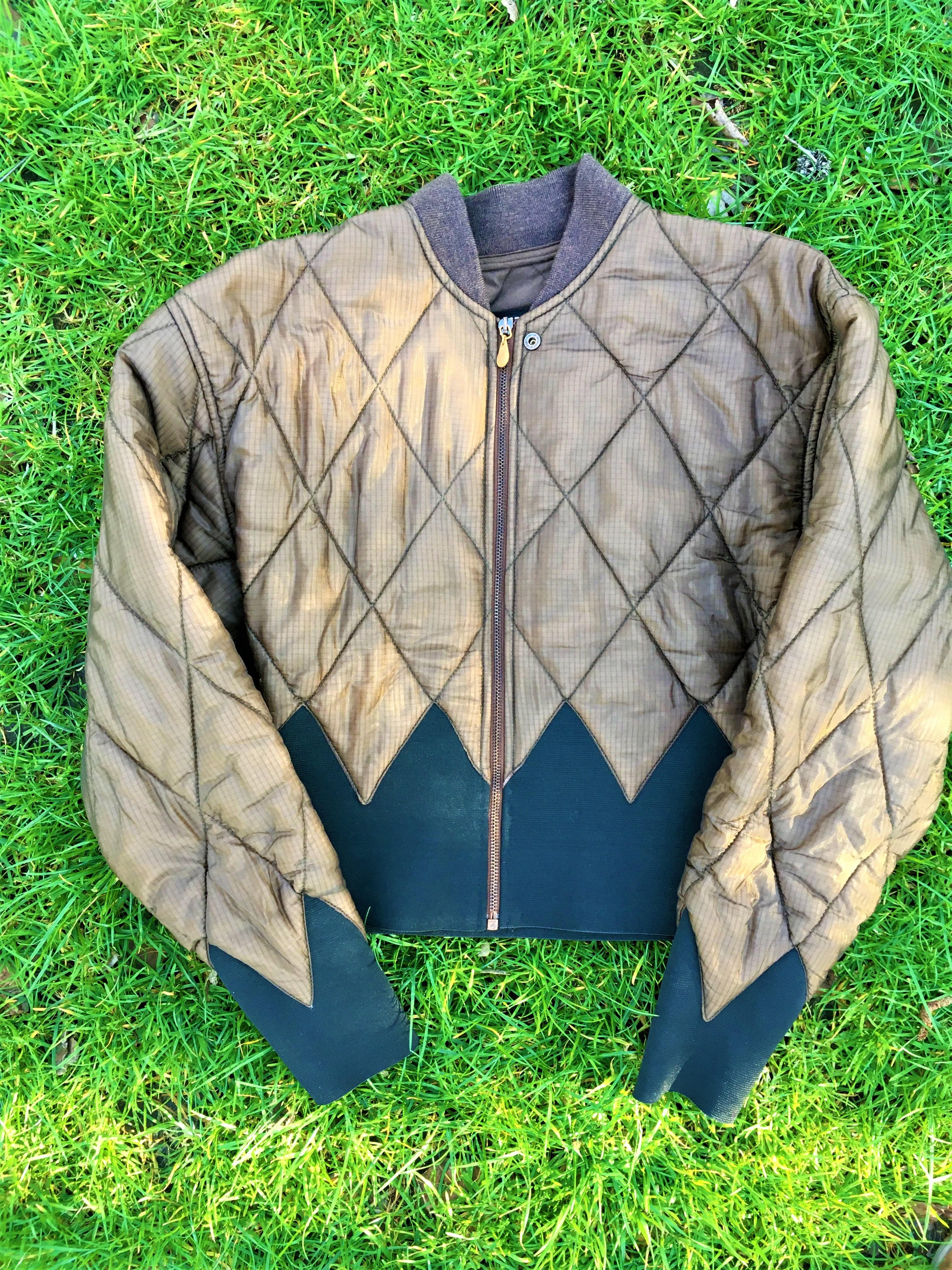 Super vintage jacket by Jean Paul Gaultier! 
Unique silhouette! 
VERY GOOD condition.
Color: khaki green / brown.

Size: Large. 
Length: 54 cm / 21.2 inch
Armpit to armpit: 50 cm / 19.7 inch
Shoulder to shoulder: 53 cm / 20.9 inch
Sleeve: 61 cm / 24