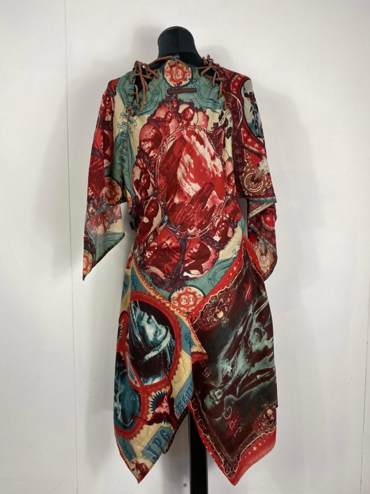 Jean Paul Gaultier jeans dress 
In 100% cotton. Amazing Native American print. Vintage piece.
size 44. Featuring various closures on the neck with leather laces.
measurements: shoulders 42cm, sleeve 58cm, length 105cm, chest 52cm. in very good