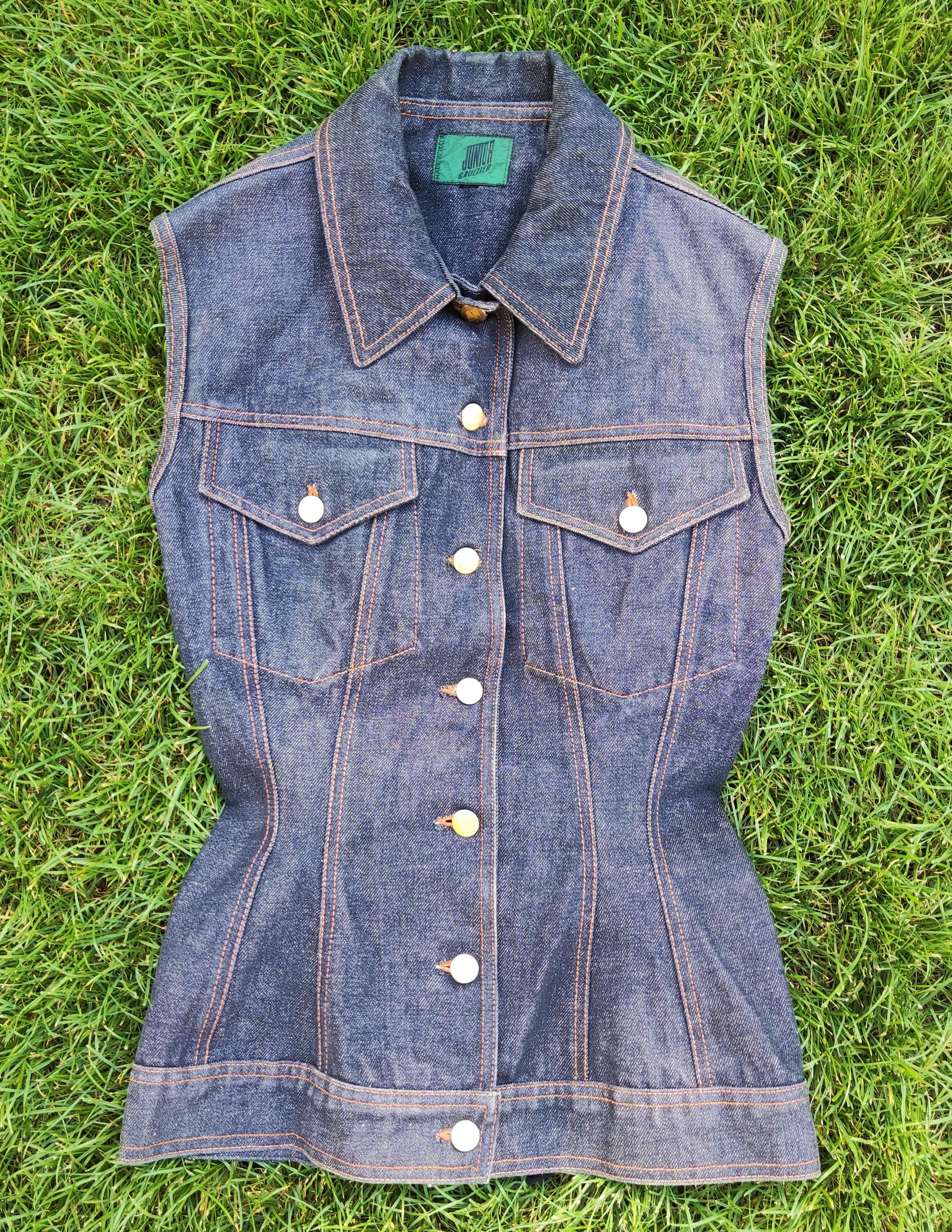 Jean Paul Gaultier Jumior Jeans Lace Up Coset Denim Optical Illusion  Vest Top

This iconic vintage Junior Gaultier corset top from the early 1990. Buttoned down the front with gold JUNIOR Gaultier buttons. 2x14-hole lacing at the back with original