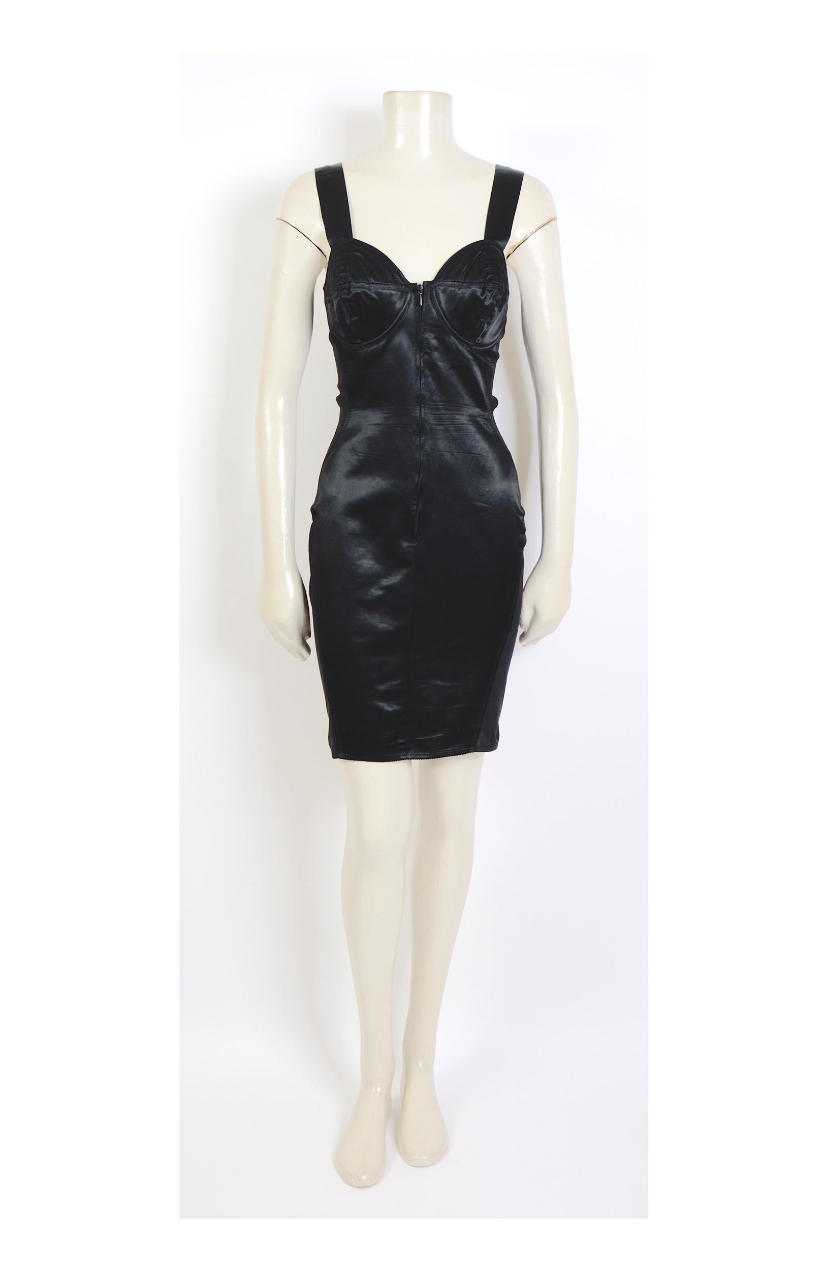 Jean-Paul Gaultier's junior 1980s collectible cone corset bodycon dress was popularized by Madonna. 
Front zipper closure with a crossed lace-up back
70% Cotton - 30% Viscose - 32% Polyamide - 48% Rubber
Made in Italy 
Size IT 44
In good condition: