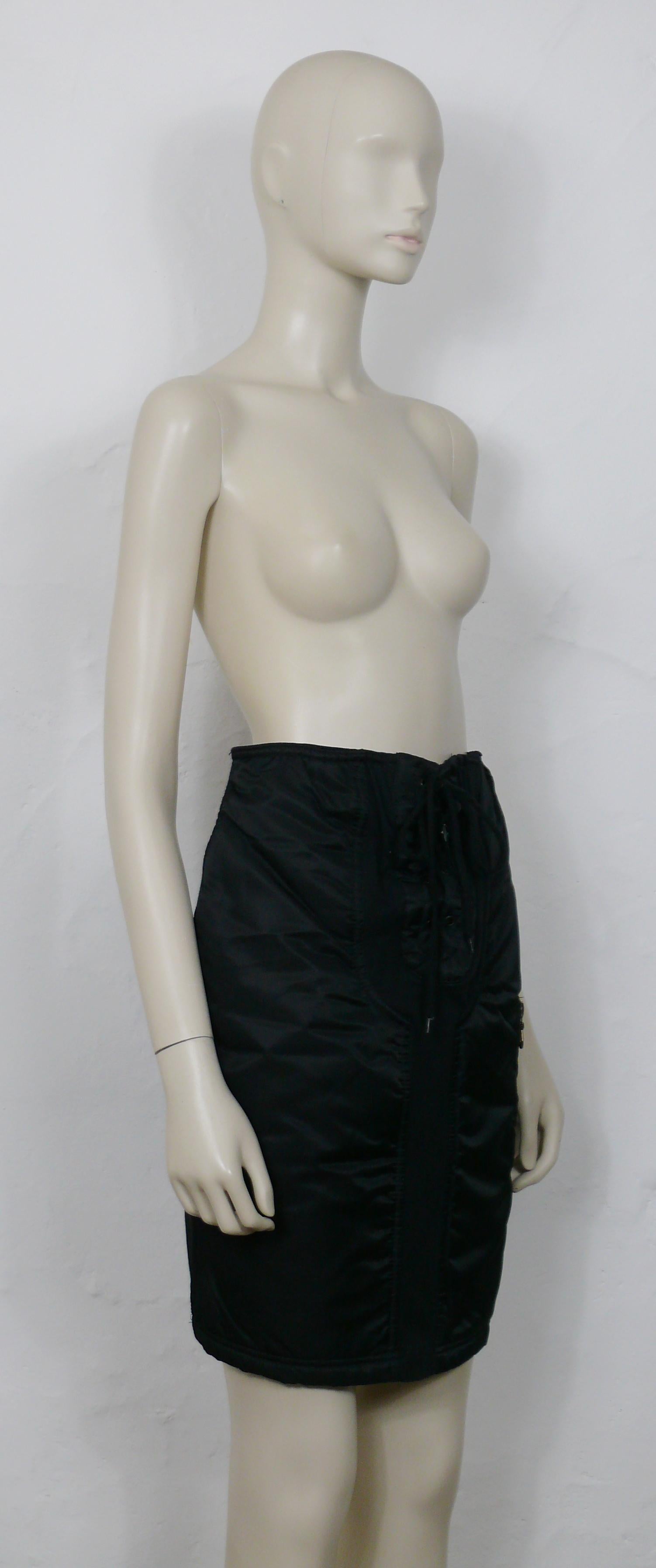 JEAN PAUL GAULTIER JUNIOR vintage black padded skirt.

This skirt features :
- Black glossed padded panels on front.
- Black stretchy material on the back and yoke on front.
- Lace front.
- Elasticated waistband.
- One zippered pocket on the front