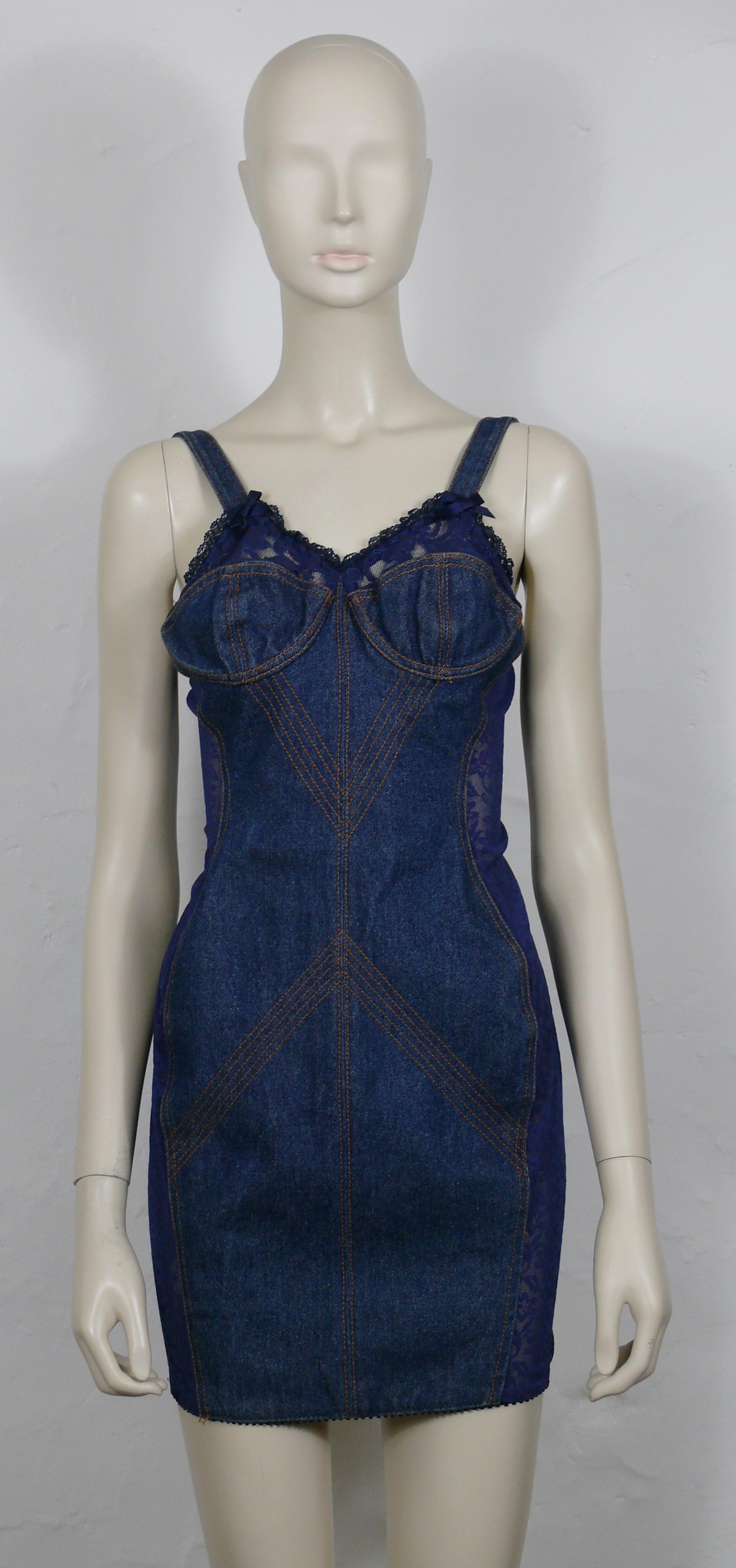 JEAN PAUL GAULTIER JUNIOR vintage blue denim bra mini dress featuring nylon panels, lace and blue satin bows.

Back zippered closure.
Orange stitching details.

Label reads JUNIOR GAULTIER Made in Italy.

Size tag reads : 40.
Please double check