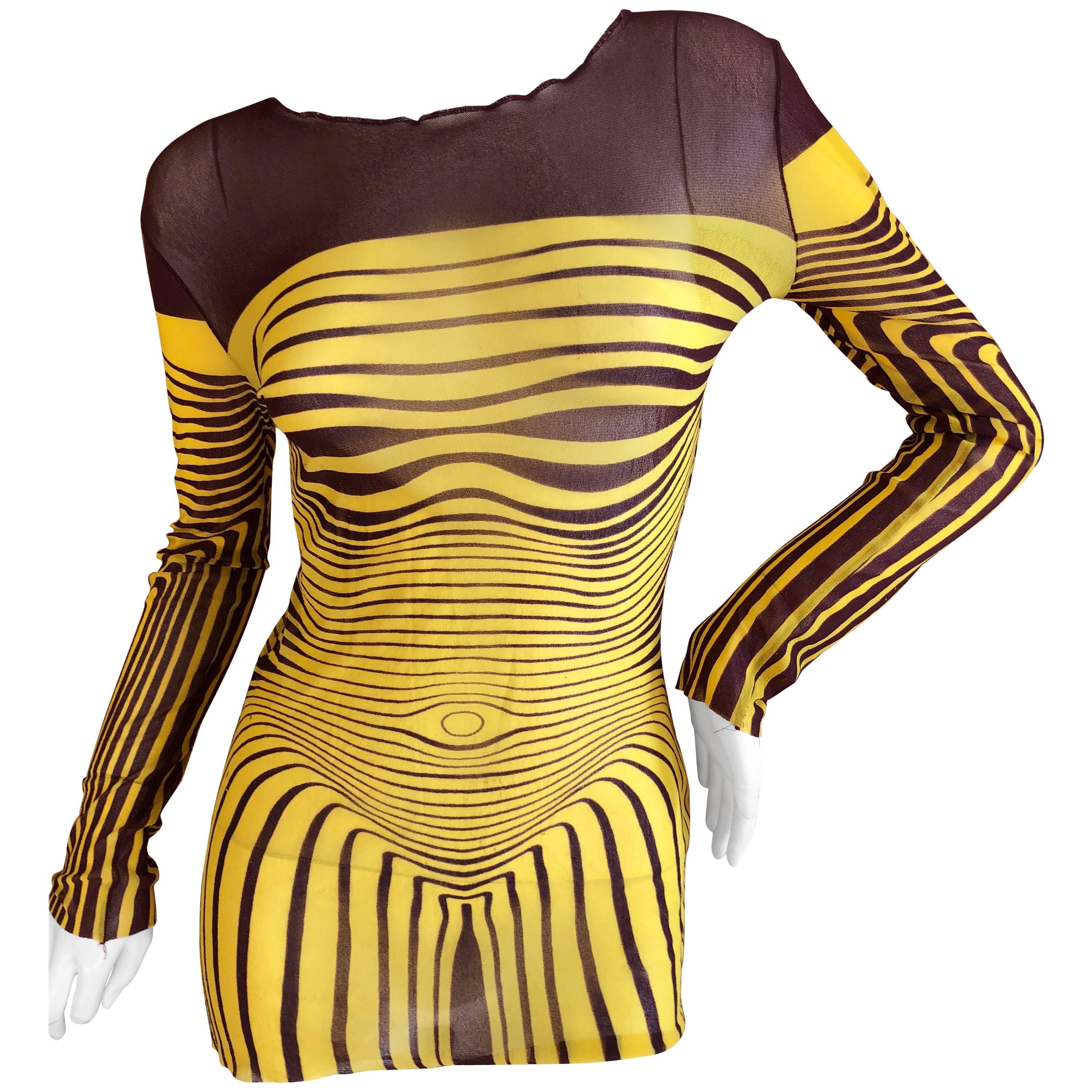 Jean Paul Gaultier Transparent Yellow Purple Optical Illusion Striped Nude Body Sculpture Venus JPG Tattoo Vintage 90s 1996 SS Mad Max Tee Top Shirt

Jean Paul Gaultier yellow optical illusion printed mesh shirt from the iconic 1996 Spring-Summer