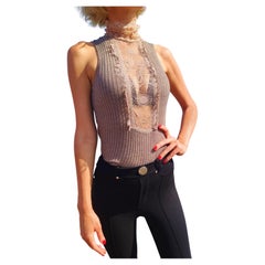 Jean Paul Gaultier Jeans in pizzo con ritaglio e dolcevita trasparente