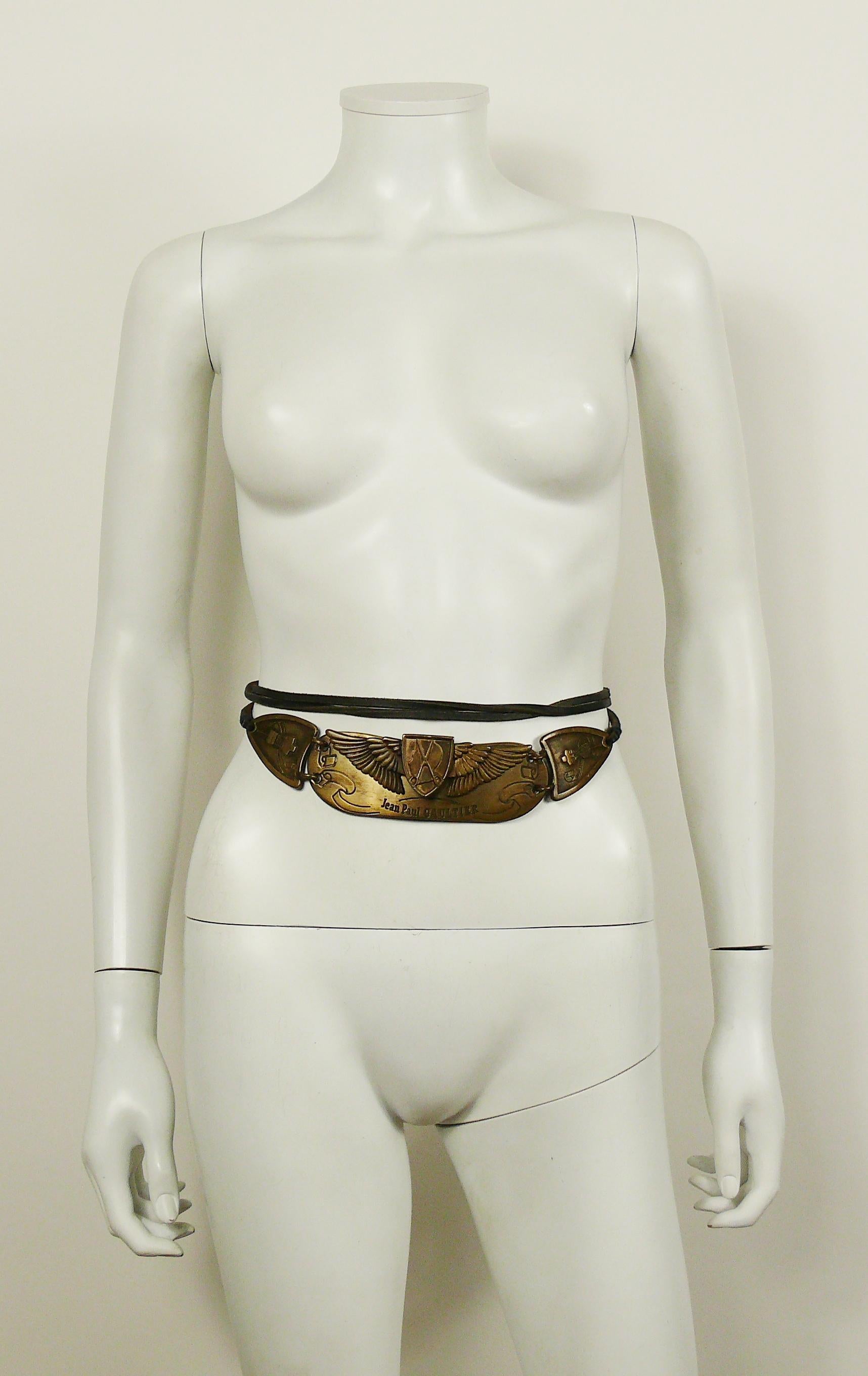 JEAN PAUL GAULTIER antiqued bronze toned belt featuring a 3-D buckle, featuring JEAN PAUL GAULTIER profile with sewing attributes.

Black leather straps.

Limited edition belt edited on the occasion of the 25th anniversary of the House of JEAN PAUL