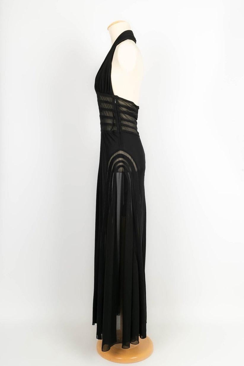 Jean Paul Gaultier -(Made in Italy) Long black dress in rayon. Size 36FR.

Additional information: 

Dimensions: 
Chest: 38 cm, Length: 140 cm
Condition: Very good condition
Seller Ref number: VR140